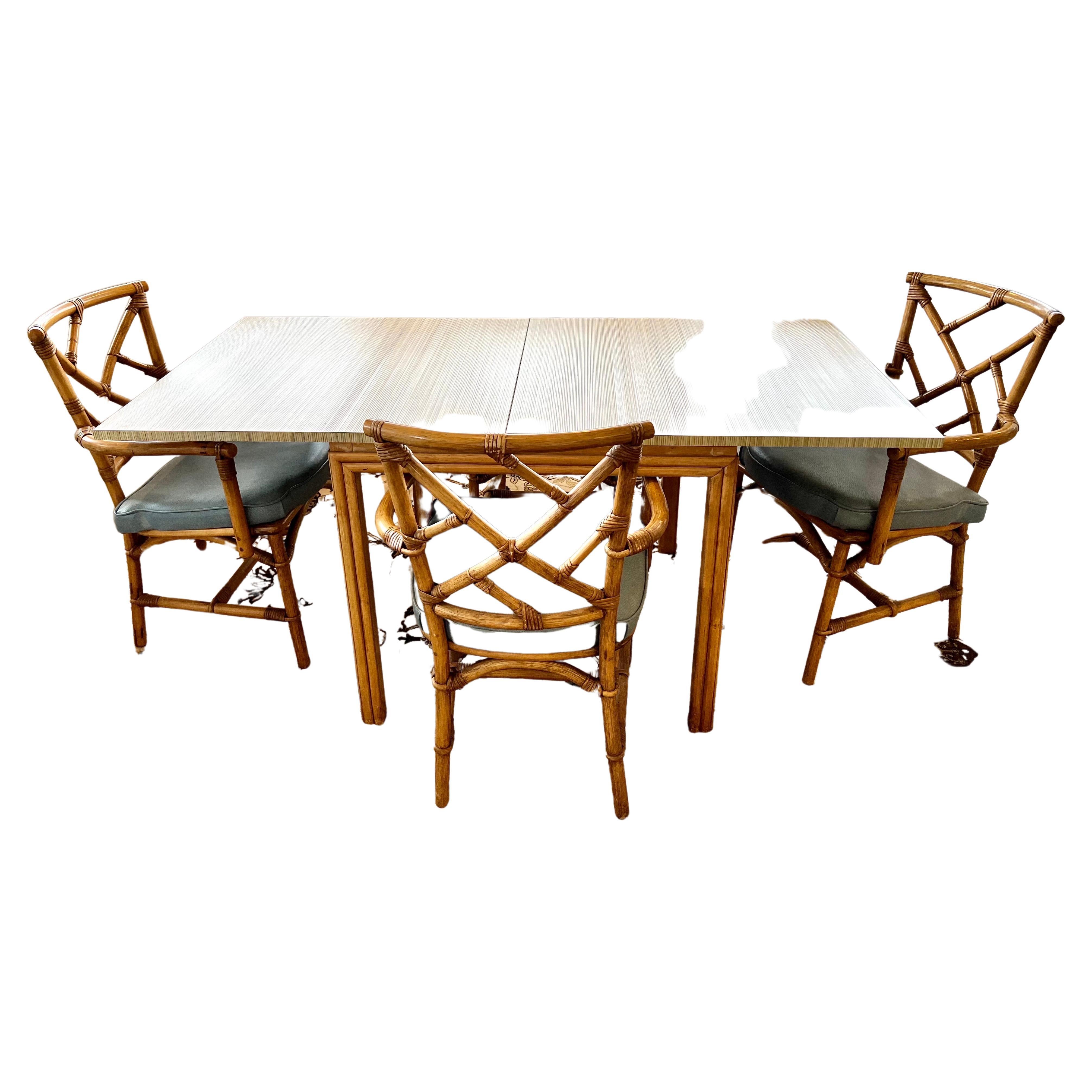 Rare bamboo expandable game table that doubles in size to a dining room table and four matching chairs - all original, circa 1970's. The dimensions above show the table open (width of 64