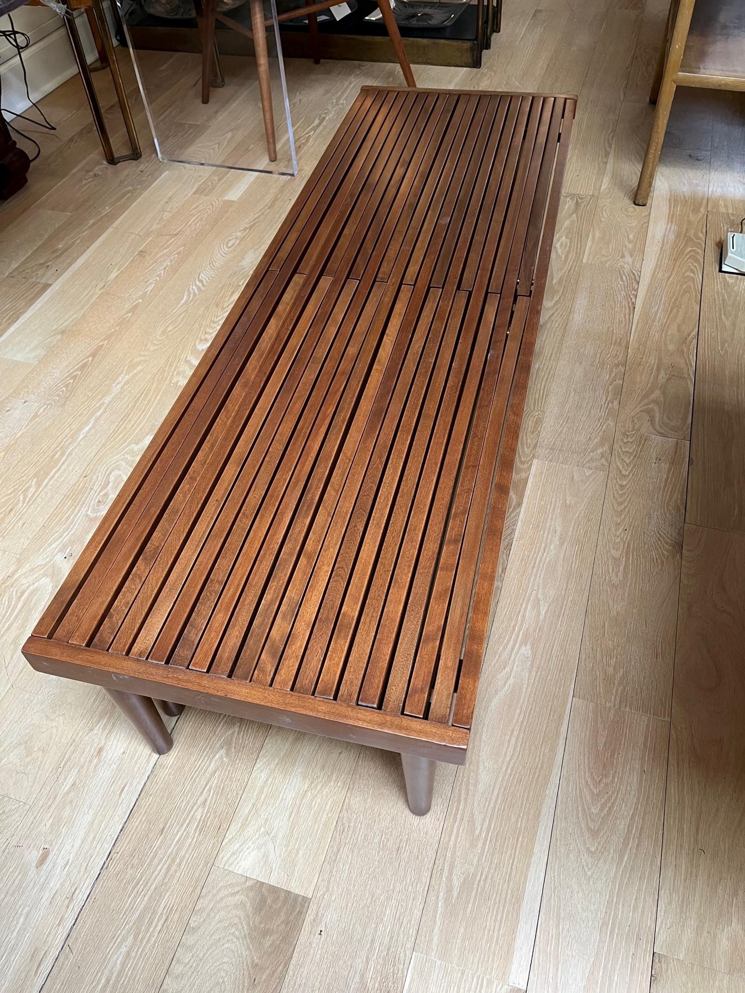Mid-Century Modern expandable slatted wood bench by John Keal
Newly refinished.