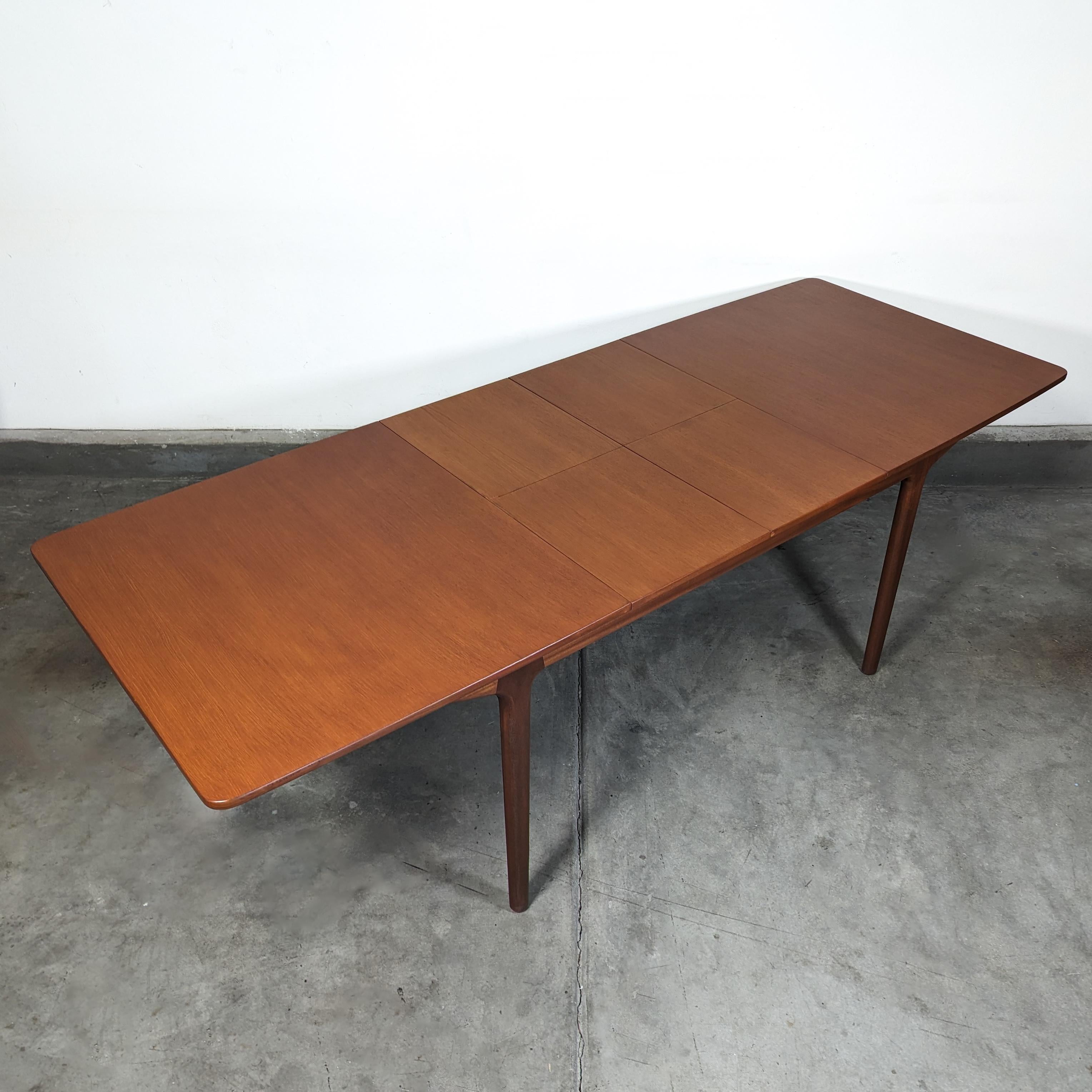 For sale is an exquisite vintage mid-century modern Teak Dining Table by McIntosh, circa 1960s, meticulously refinished to restore its original splendor. This iconic piece is a testament to timeless design and superior craftsmanship, offering both