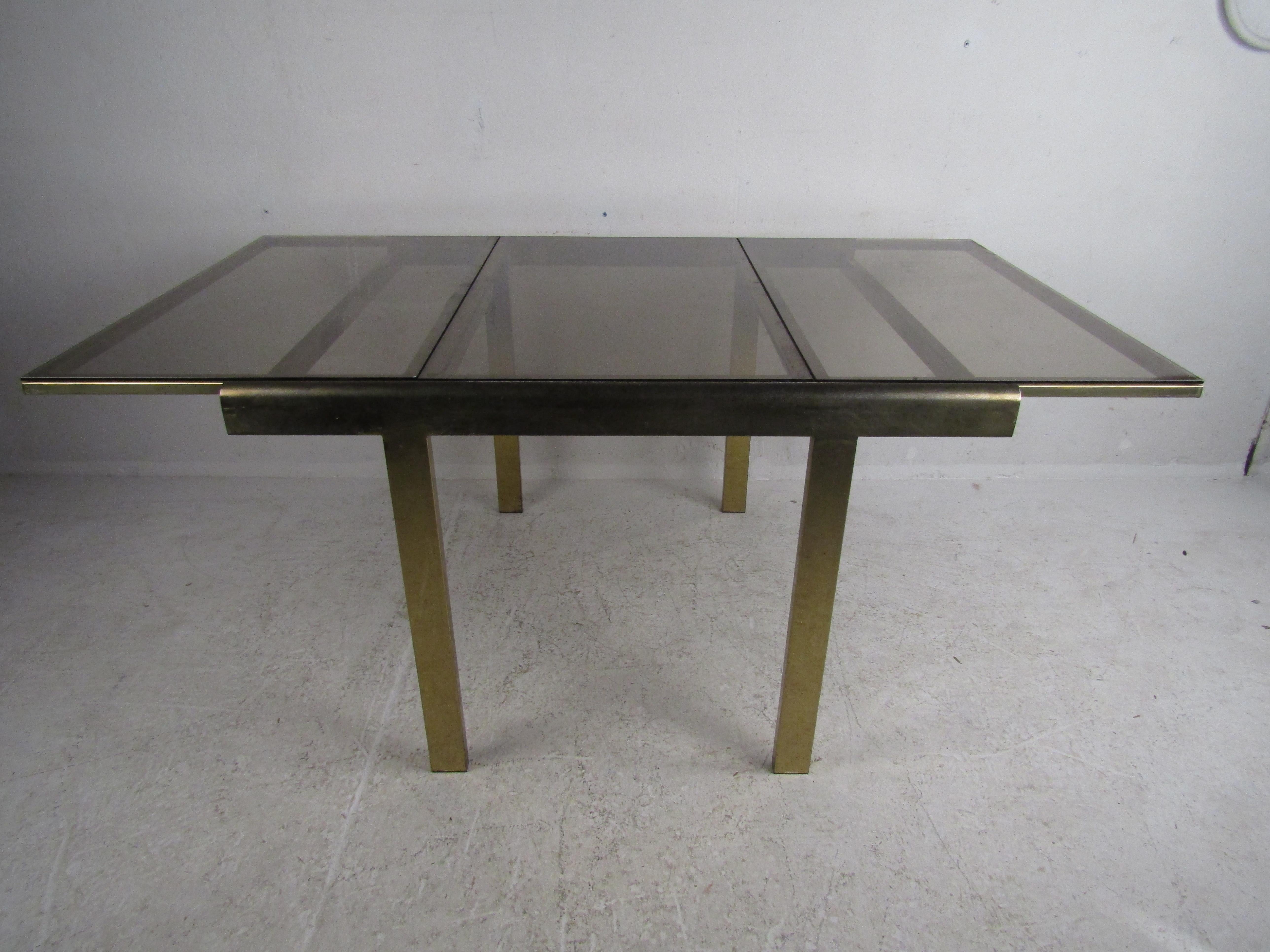 American Mid-Century Modern Expanding Brass Dining Table with a Smoked Glass Top For Sale