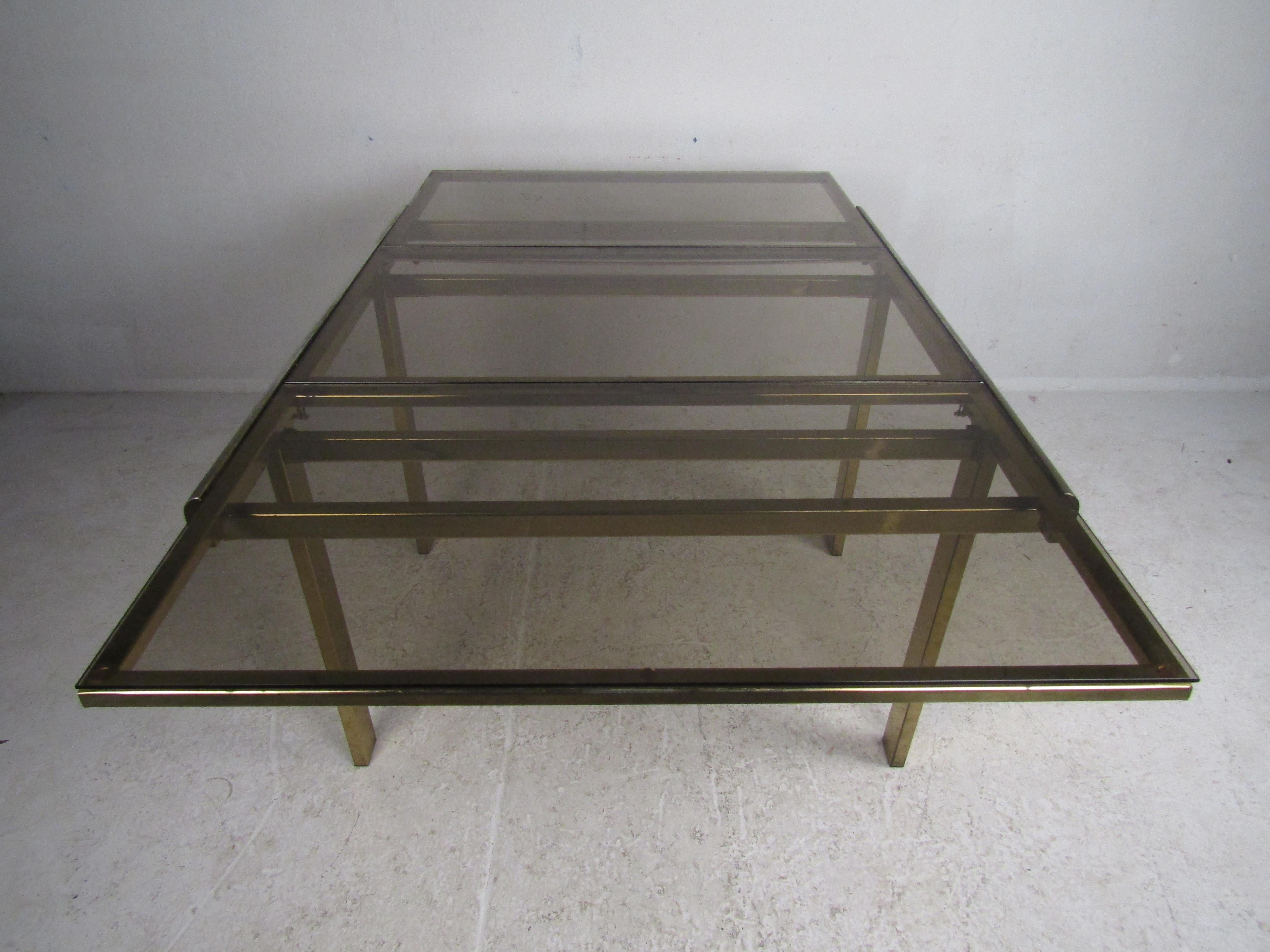 American Mid-Century Modern Expanding Brass Dining Table with a Smoked Glass Top For Sale