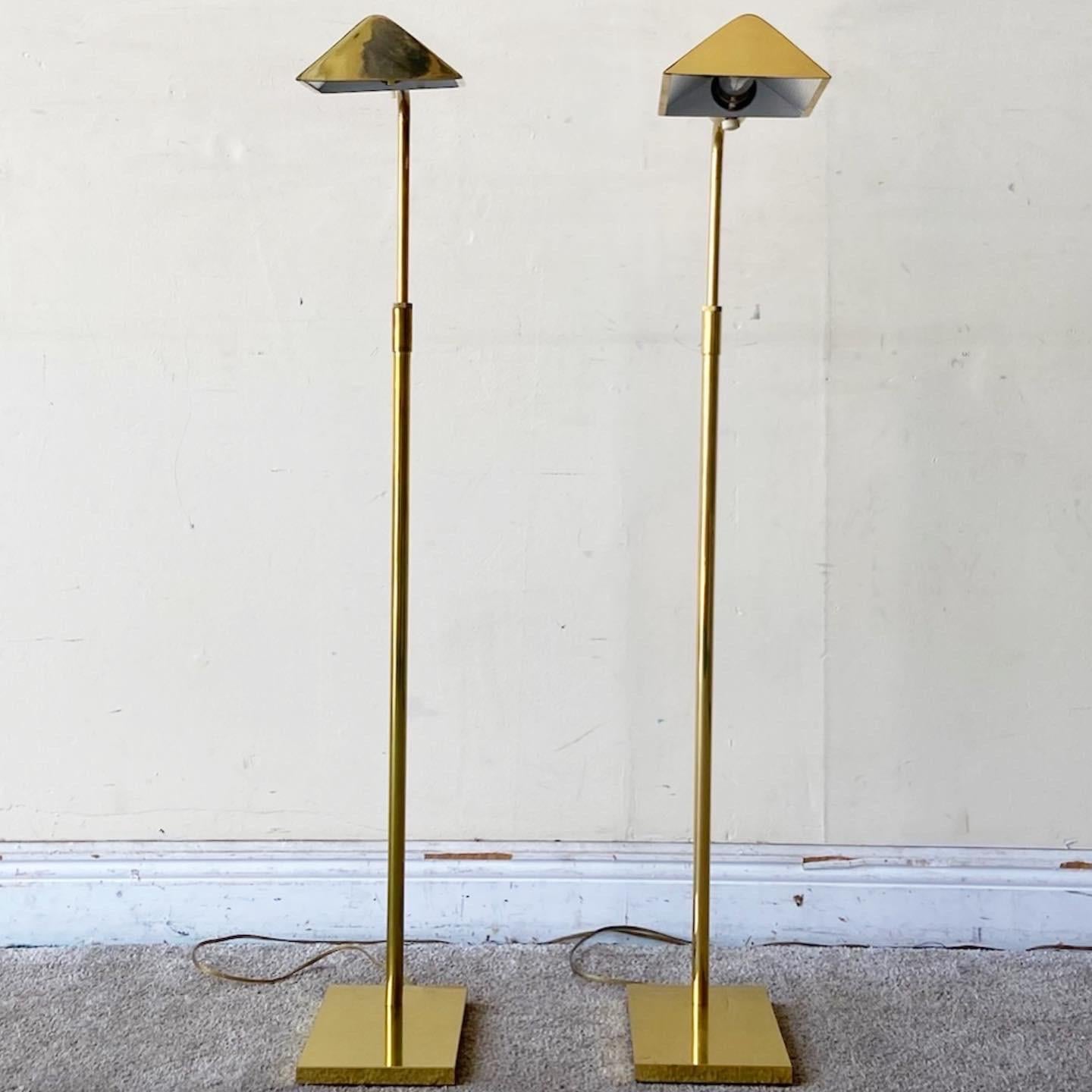 Incredible pair of mid Century Modern adjustable pharmacy lamps. Each features a folded finish with a rectangular base.
Extends from 35”H to 46”H