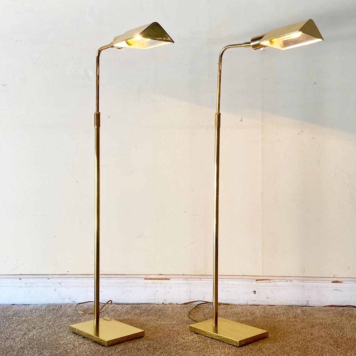 Incredible pair of Mid-Century Modern adjustable pharmacy lamps. Each features a folded finish with a rectangular base.

Extends from 35”H to 46”H.