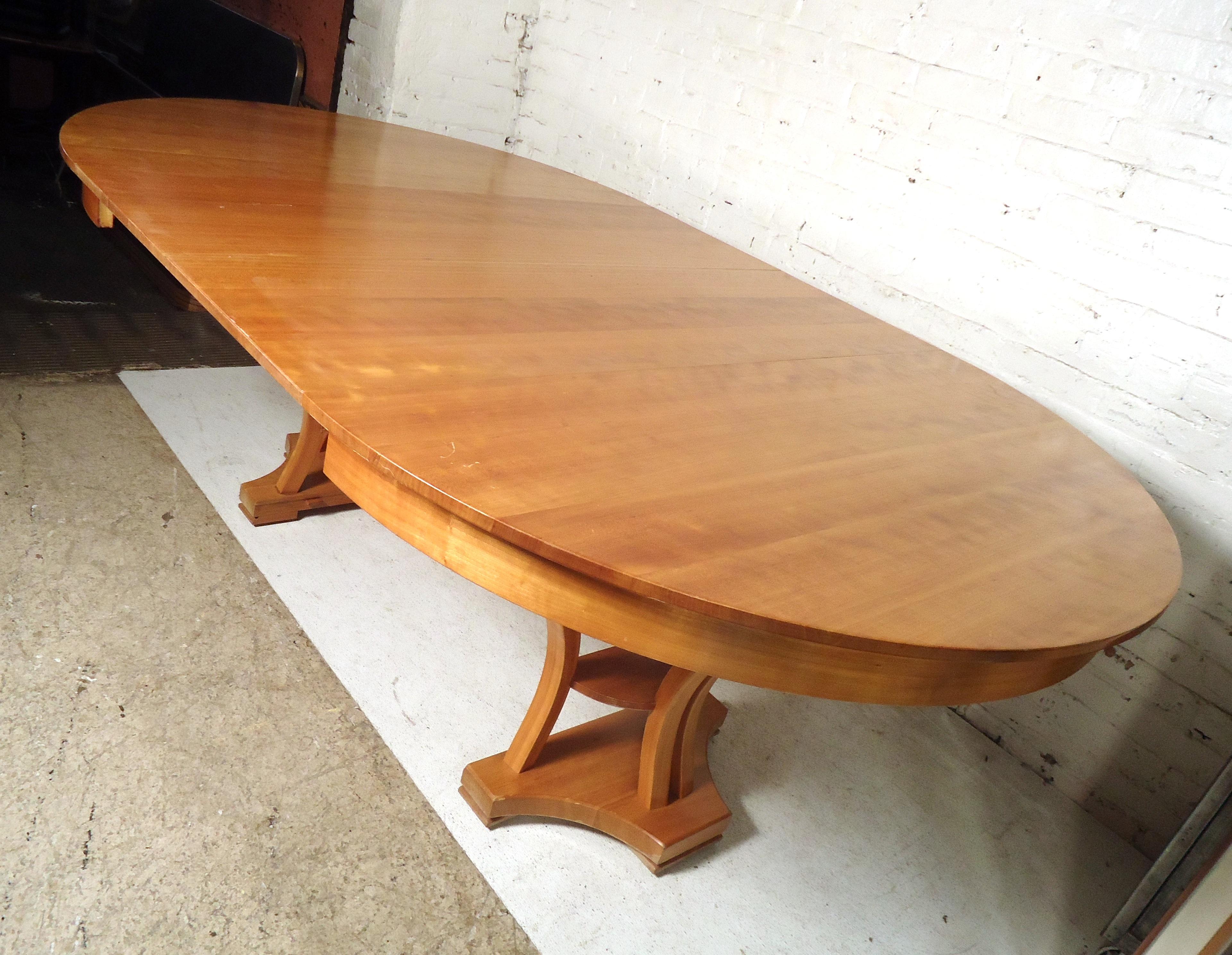 Gorgeous vintage modern extendable table extends from round to oval featuring two wood leaves.
Open width: 85