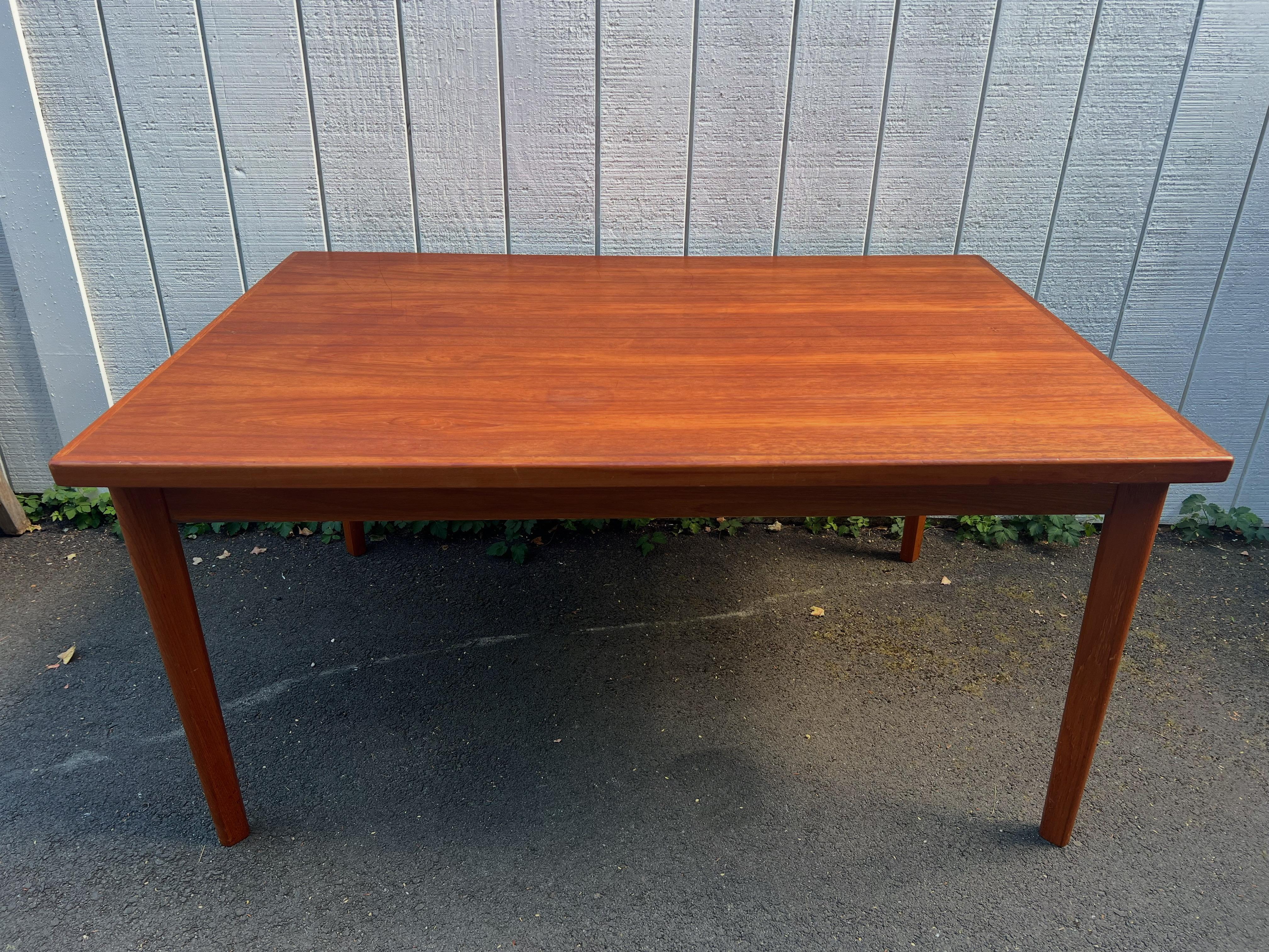 Mid Century Modern Extendable Teak Dining Table . Scandinavian smart design . Leaf extensions store underneath table and easily pop out to lift up to pop in place. Solid teak legs.  59