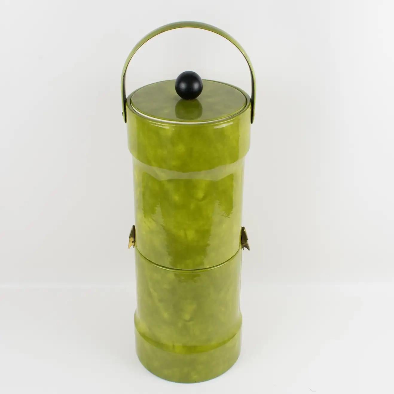 This stunning Mid-Century Modern barware accessory double-decker ice bucket is made of luminous green PVC leather Vinyl. The extra tall cylindric-shaped body opens in two sections with a lid and one handle on the top. Hinges attach the lower section