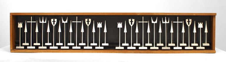 American Mid-Century Modern extruded aluminum chess set with 32 stylized figures in the original presentation box. (Stamped: Austin Enterprises 1962, made by ALCOA) Case measurements: (30.75