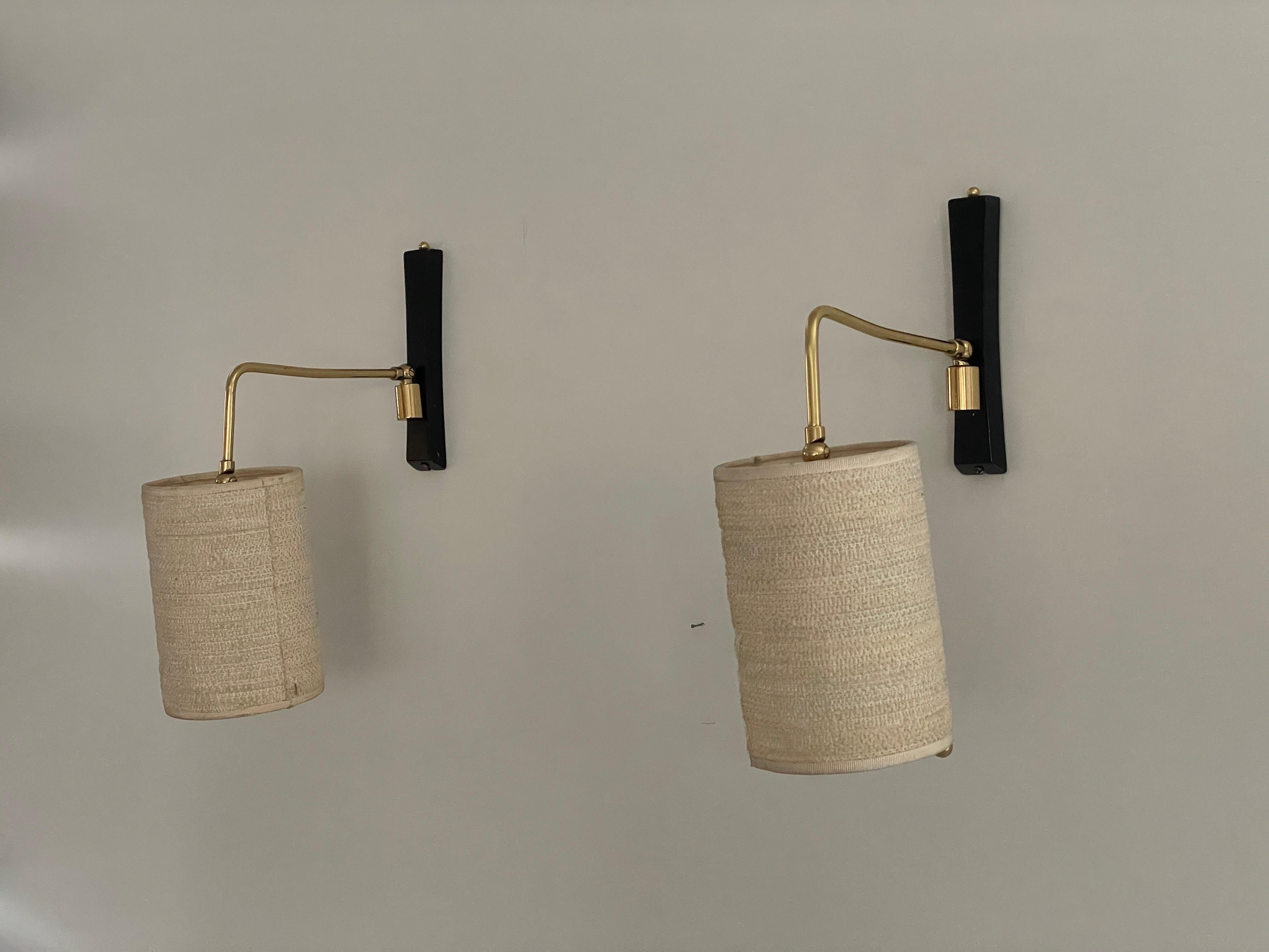 Mid-century Modern Fabric Shade Pair of Sconces with Brass Neck, 1960s, Germany

Lampshade is in very good vintage condition.

Both the head and the rod are adjustable

This lamp works with E27 light bulbs. 
Wired and suitable to use with 220V and