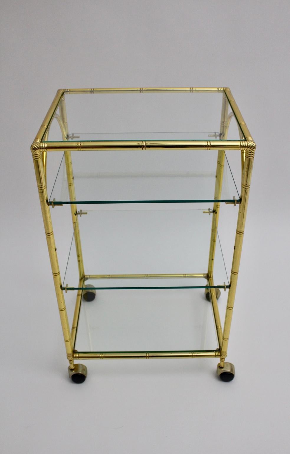 This presented gilded faux bamboo bar cart attributed to Maison Baguès France 1960s features four glass plates and four wheels.
The glass plates have no chips or damages.
The condition is very good with minor signs of age.
All measures are