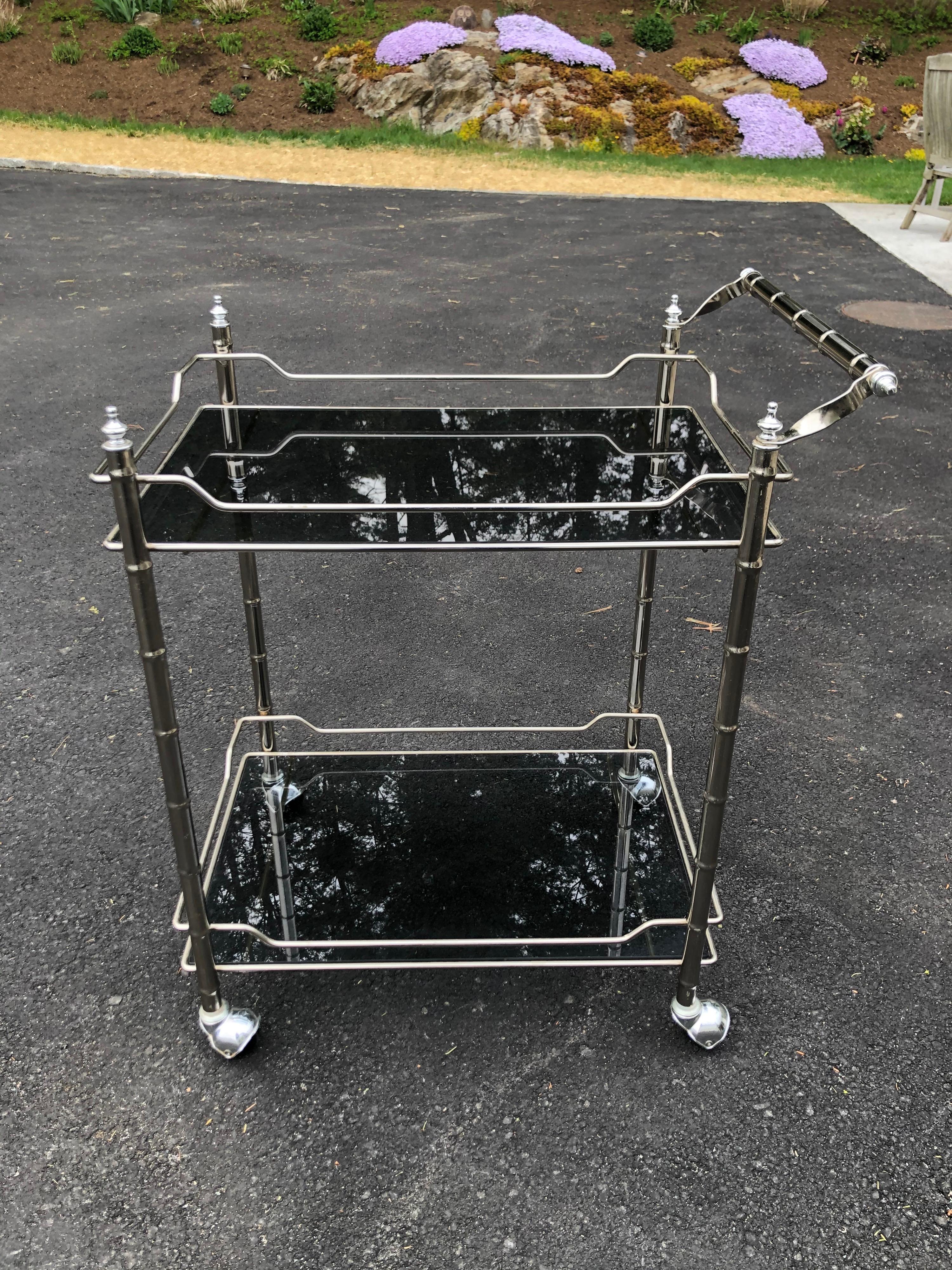 Mid-Century Modern faux bamboo bar cart in chrome. Sophisticated and elegant and perfect for entertaining.