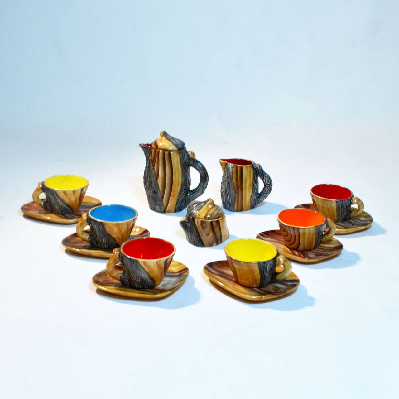 Complete set of Grandjean-Jourdan’s faux bois tableware.
This father and son team of post-WWII regional artists created their hand-painted pottery in the famed town of Vallauris, the same area where Braque’s and Pablo Picasso produced their own