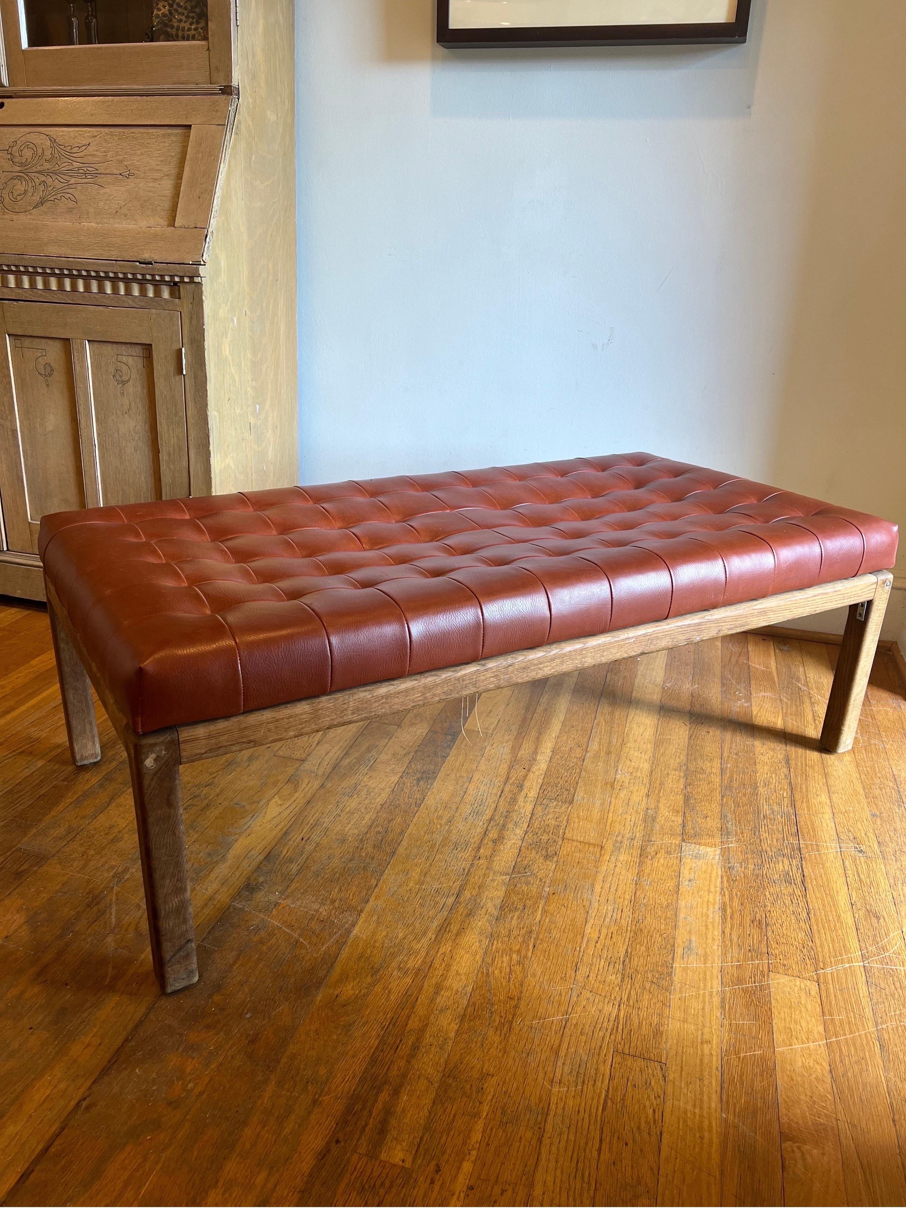 MCM tufted leather/vinyl bench with teak base.  
Deep brown color.  

Original upholstery.  