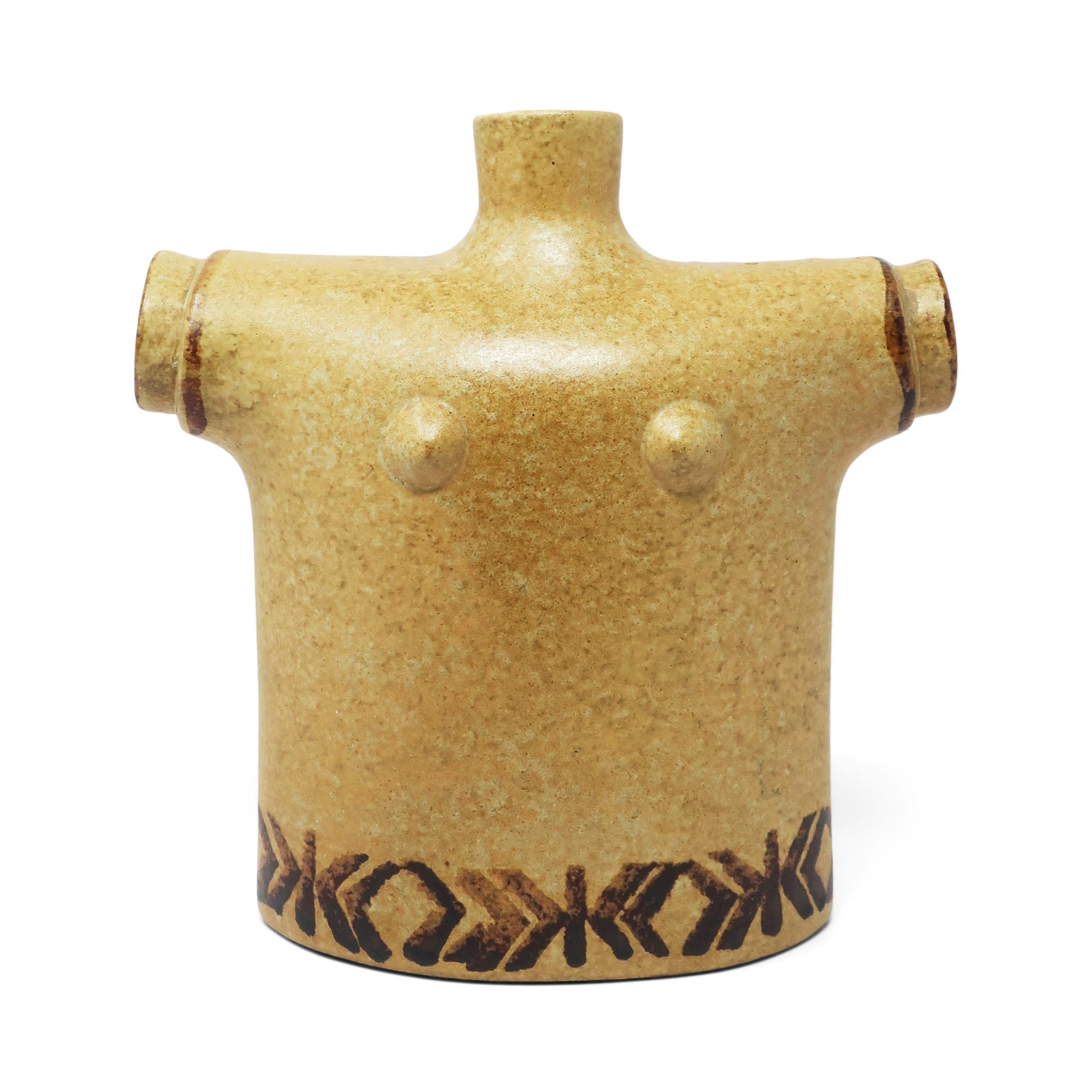 A fantastic pottery vase in the form of a female torso with a light tan textured glaze and dark brown decoration.  Perfect as a decorative and it is glazed inside so can be used with flowers in water.

In very good condition with light wear
