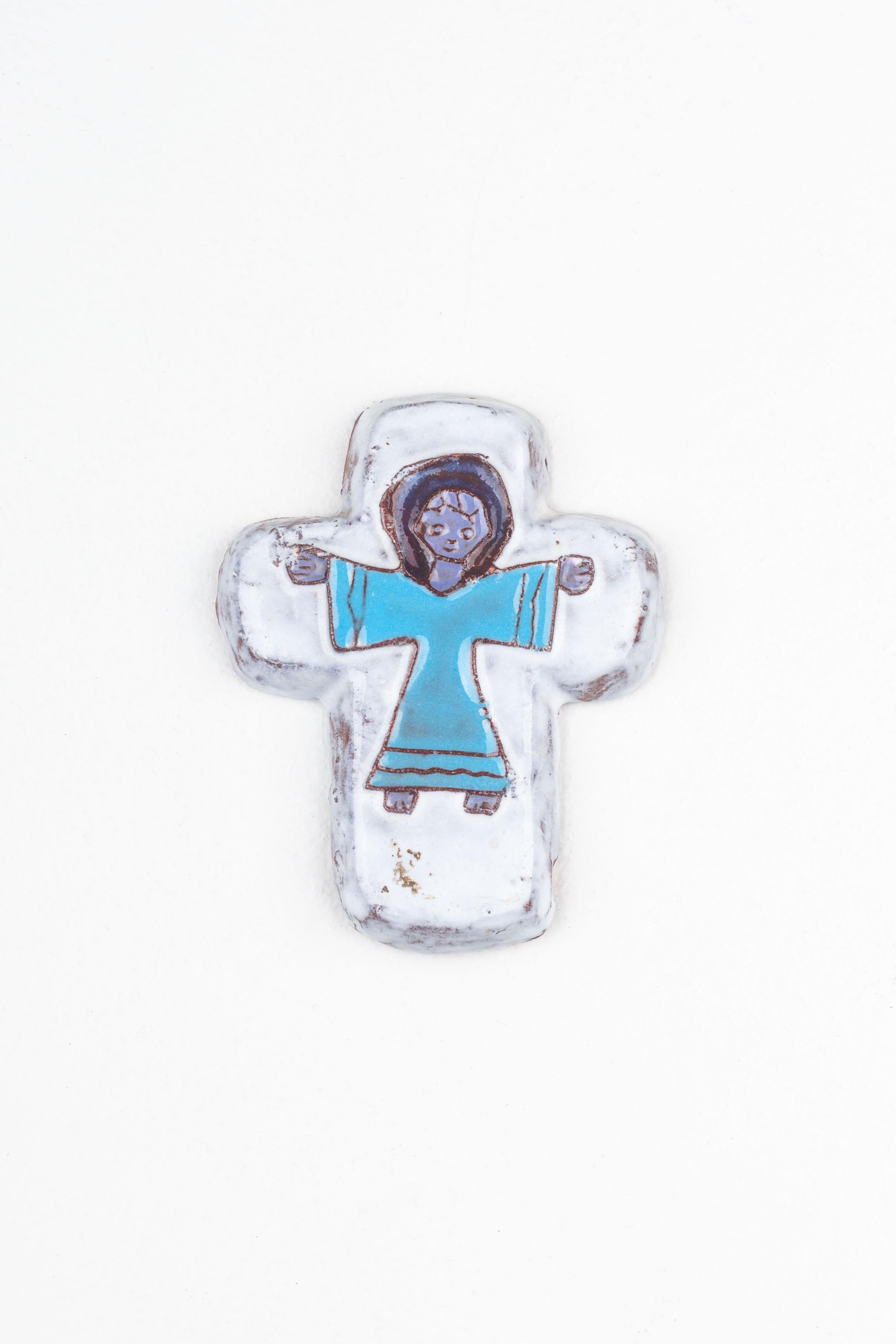 This handcrafted ceramic cross is a vibrant exemplar of mid-century modern design, infused with the characteristic playfulness and colorfulness of the era. European studio pottery artists, celebrated for their innovative and expressive approaches,