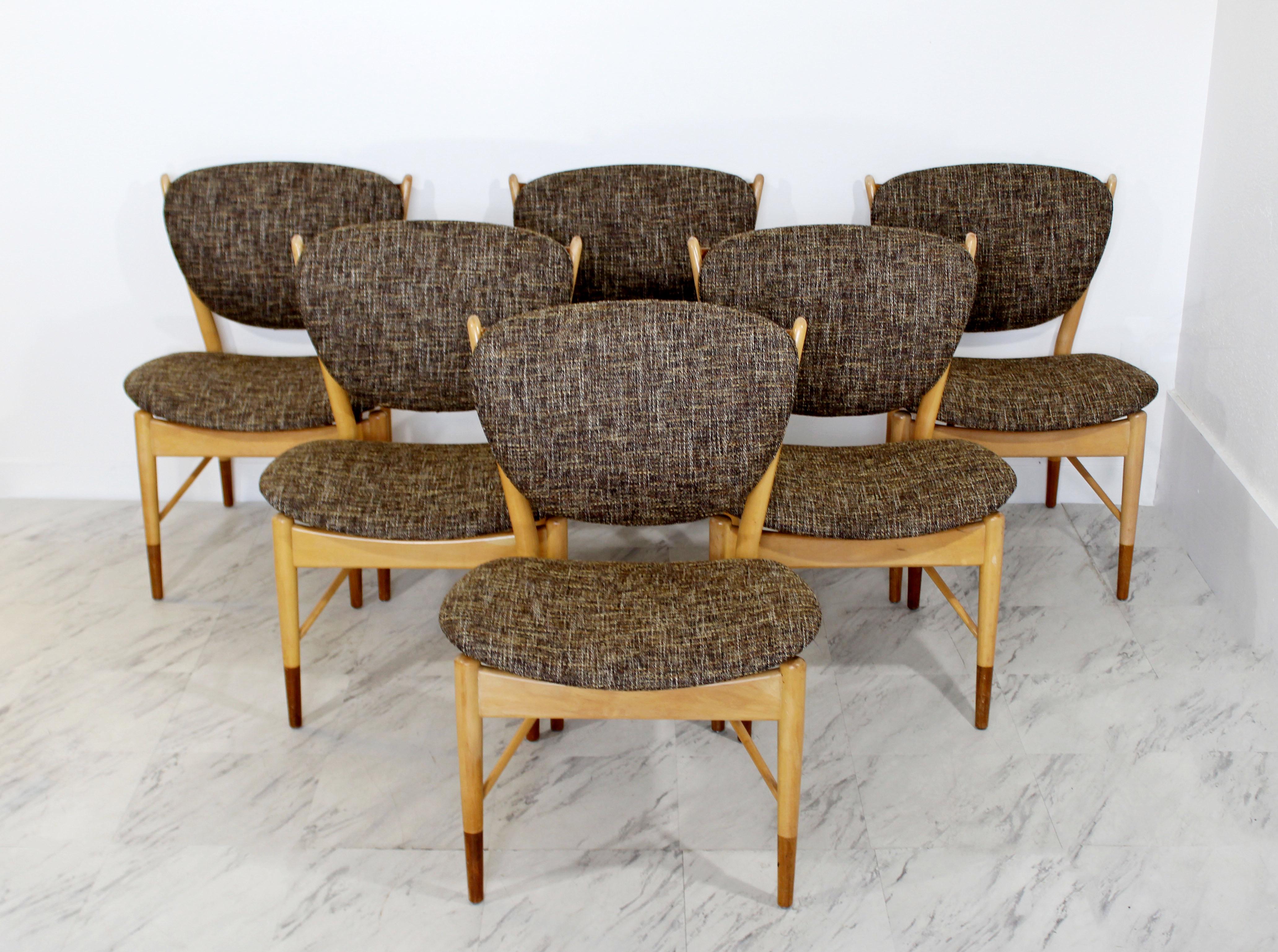 For your consideration is a wonderful, set of six side dining chairs by Finn Juhl NV-51 for the Baker Furniture Company, circa the 1960s. They are maple and teak. They have just come back from being professionally reupholstered in a beautiful