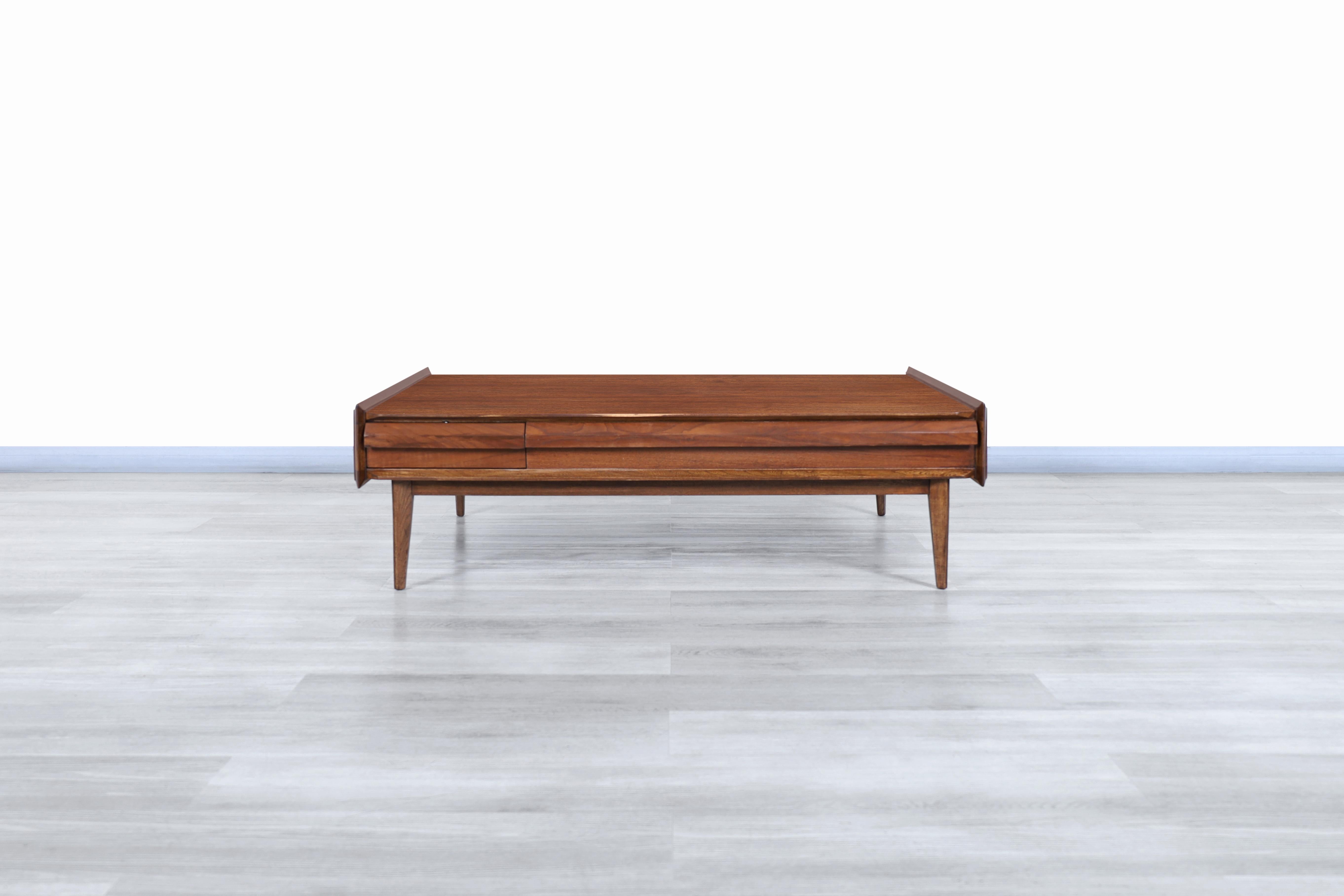 Fabulous Mid-Century Modern “First Edition” walnut coffee table designed and manufactured by Lane Furniture Altavista in the United States, circa 1960s. This table's Minimalist design stands out for its functionality and particular size. It features