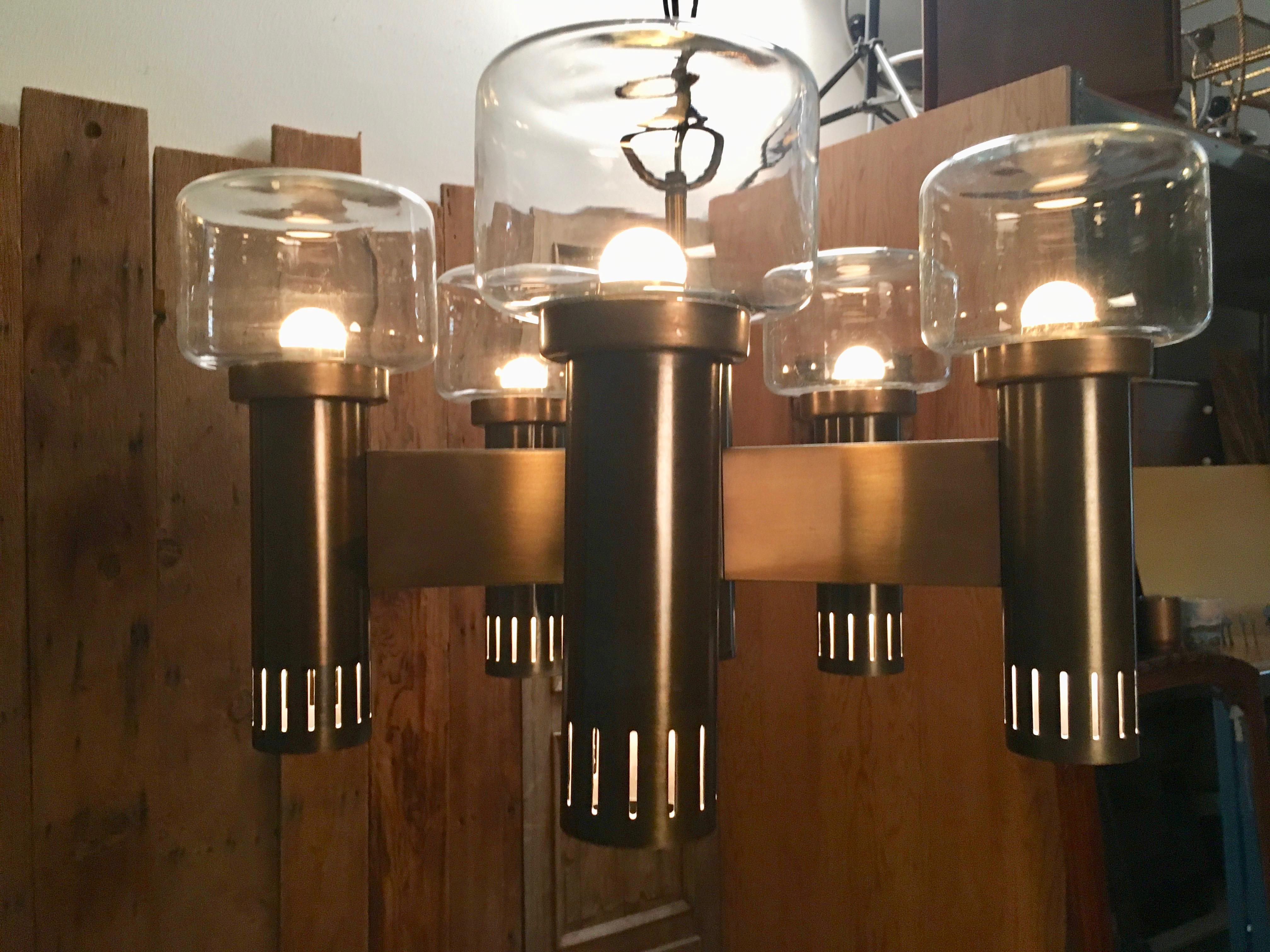 Bronze finish with round flat top glass also down lighting in side the tubes.