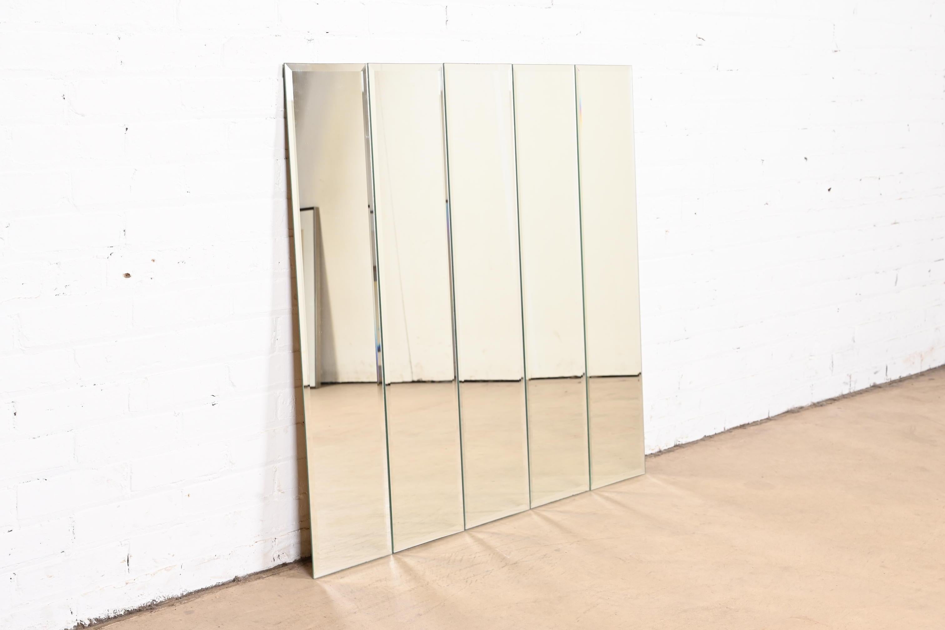 A stylish Mid-Century Modern five-panel beveled wall mirror

USA, 1970s

Measures: 39.75