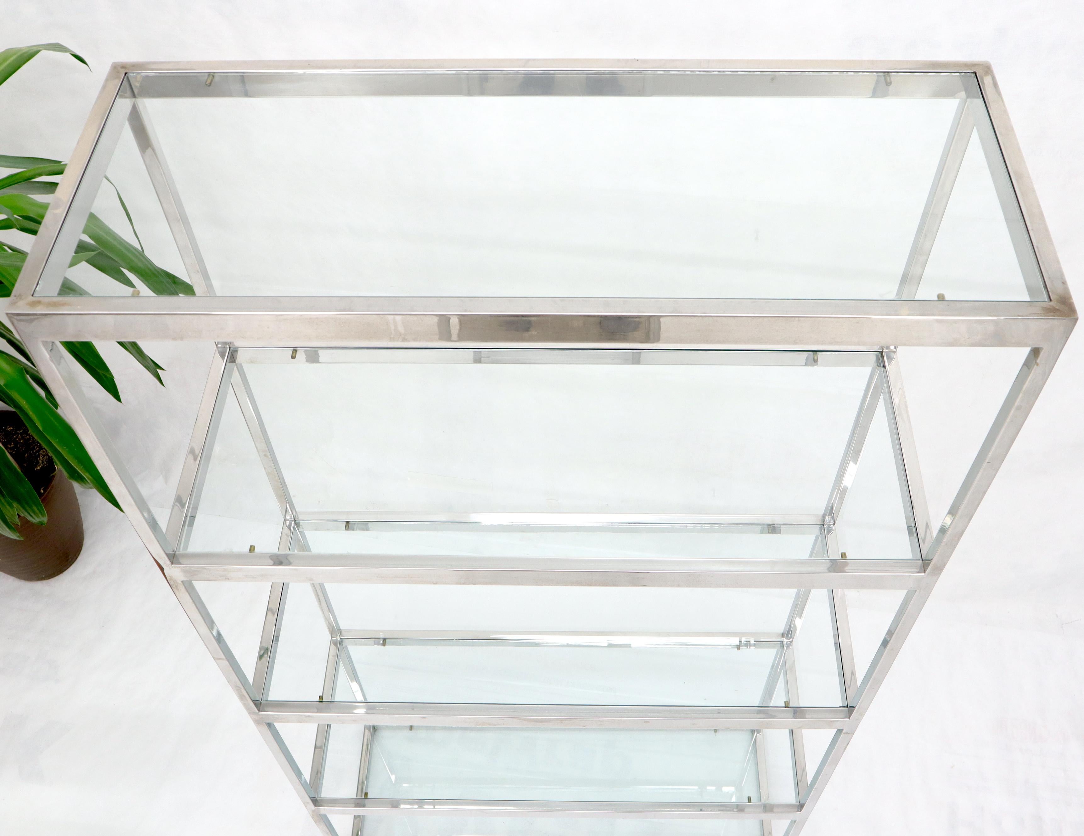 glass and chrome shelving unit