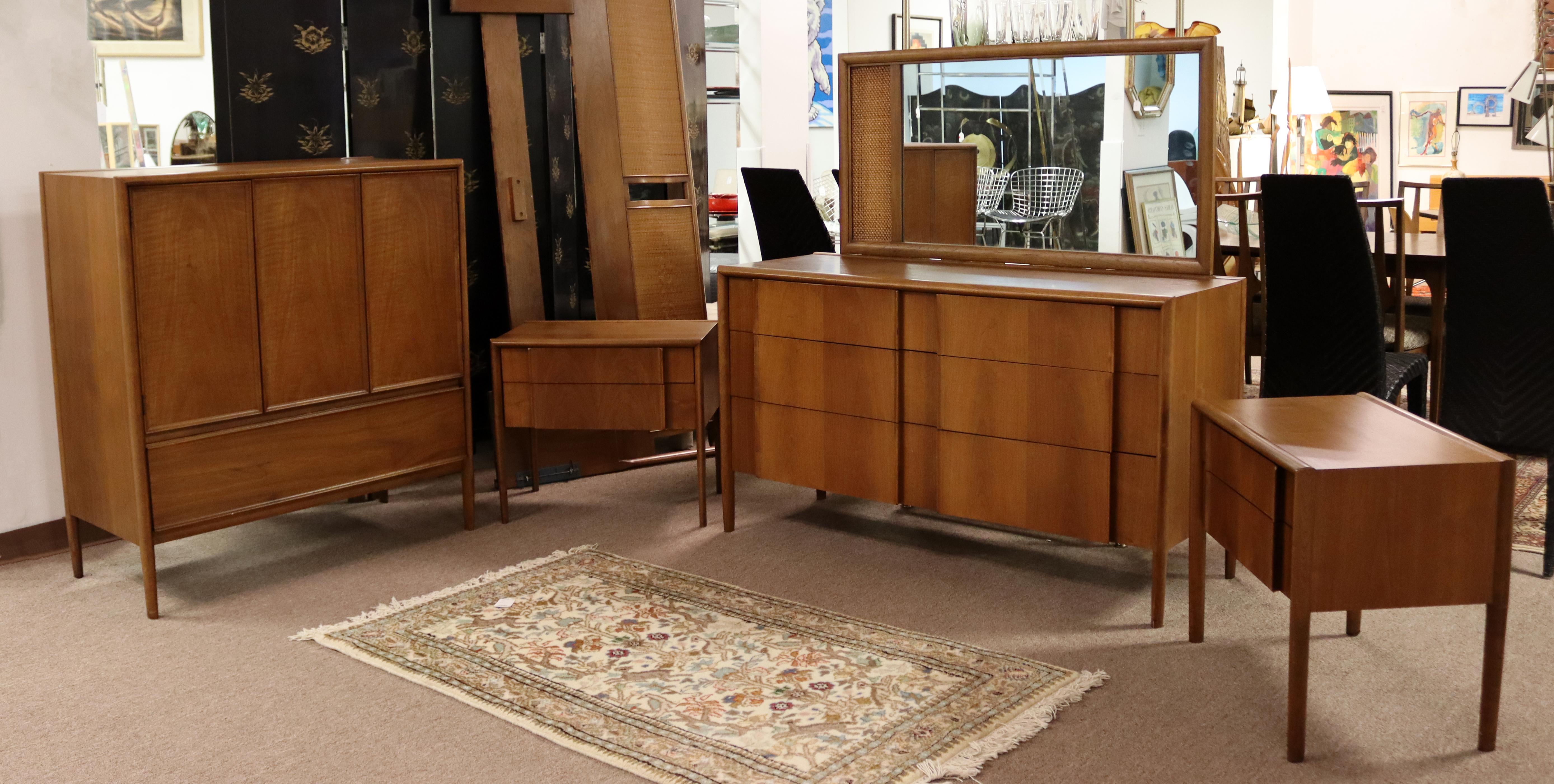 For your consideration is a desirable, walnut bedroom set; including a highboy dresser with with nine drawers, a pair of nightstands, a mirror, a lowboy dresser with six drawers and a headboard for a King sized bed, by Barney Flagg for Drexel's
