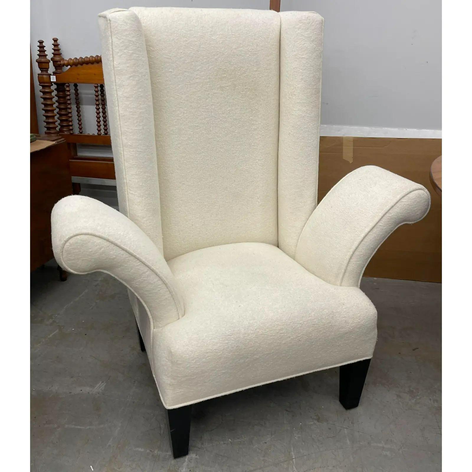 Mid Century Modern Flamboyant White Wingback Chair. It features eccentric flaring arms in elegant white upholstery.

Additional information: 
Materials: Fabric, Wood
Color: White
Period: 1960s
Styles: Mid-Century Modern
Number of Seats: 1
Item Type: