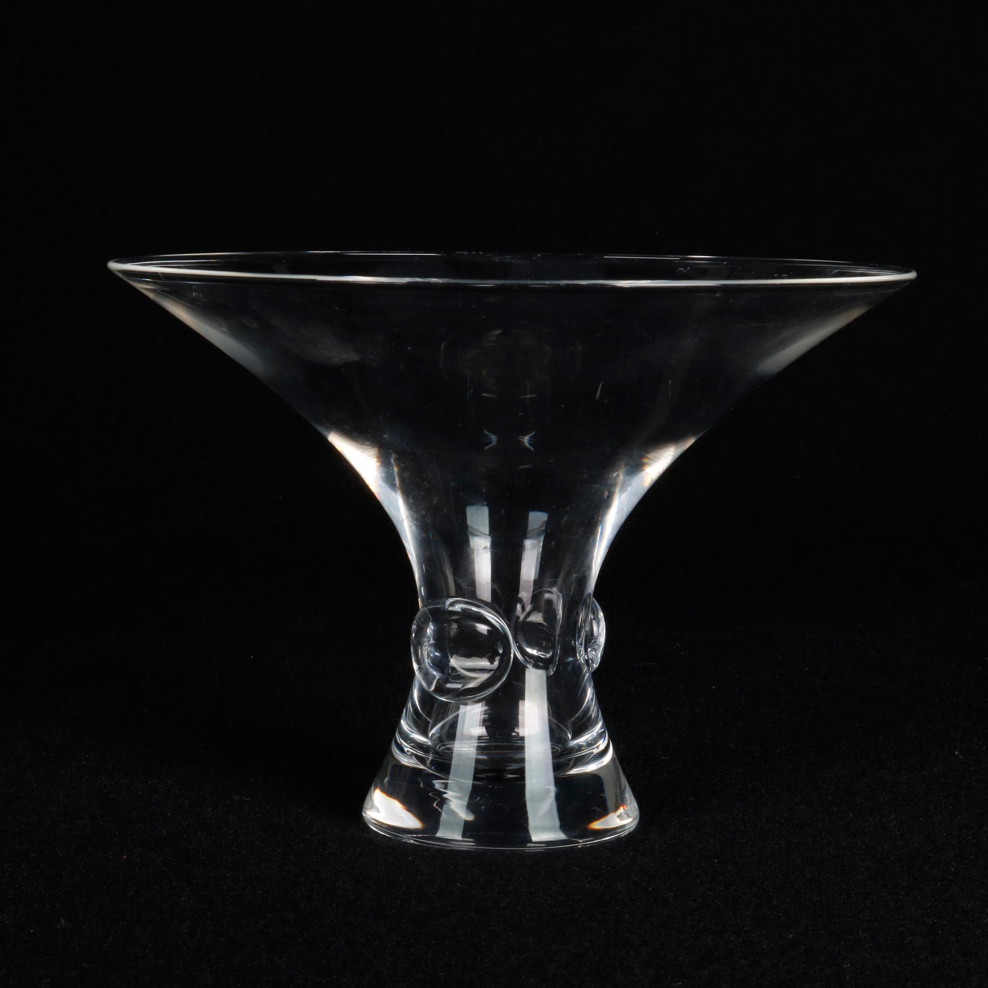 A Mid-Century Modern crystal vase by Steuben Glass Works offers flared form with stem having applied thumb print elements, signed on base as photographed, 20th century


Measures: 5