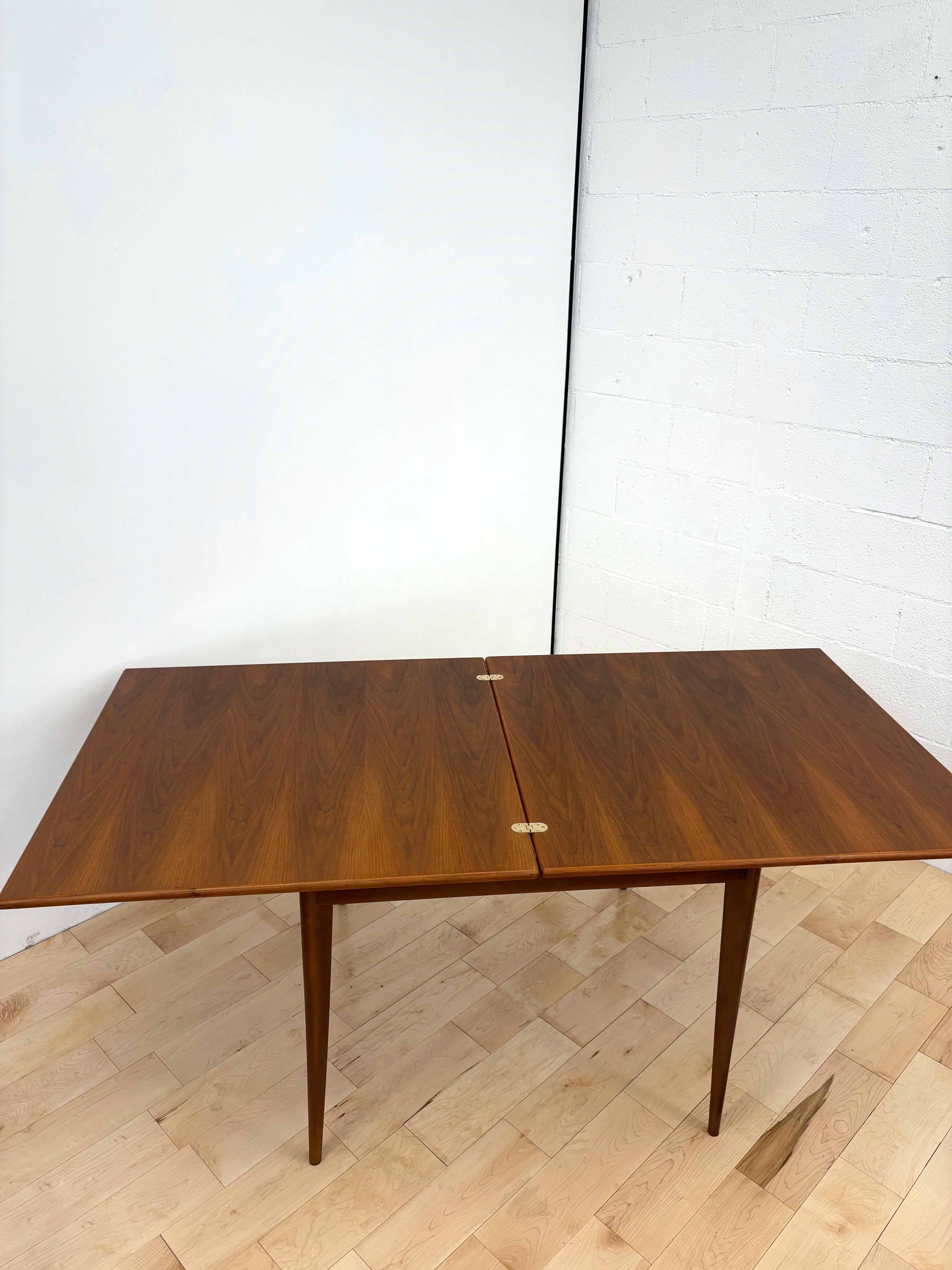 Swedish Mid Century Modern Flip Top Teak and walnut expandable Dining Table by Vetlanda