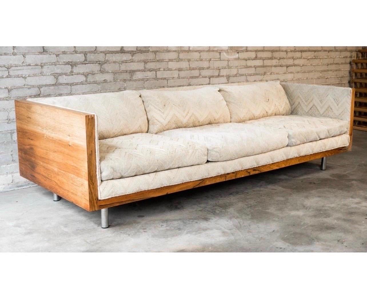 Rare cased rosewood floating from the 1960's with no hallmarks. Reminiscent of the Milo Baughman cased sofa. It is all original and will need to be reupholstered. Some of the veneer on the the rosewood is loose and or faded and will need some