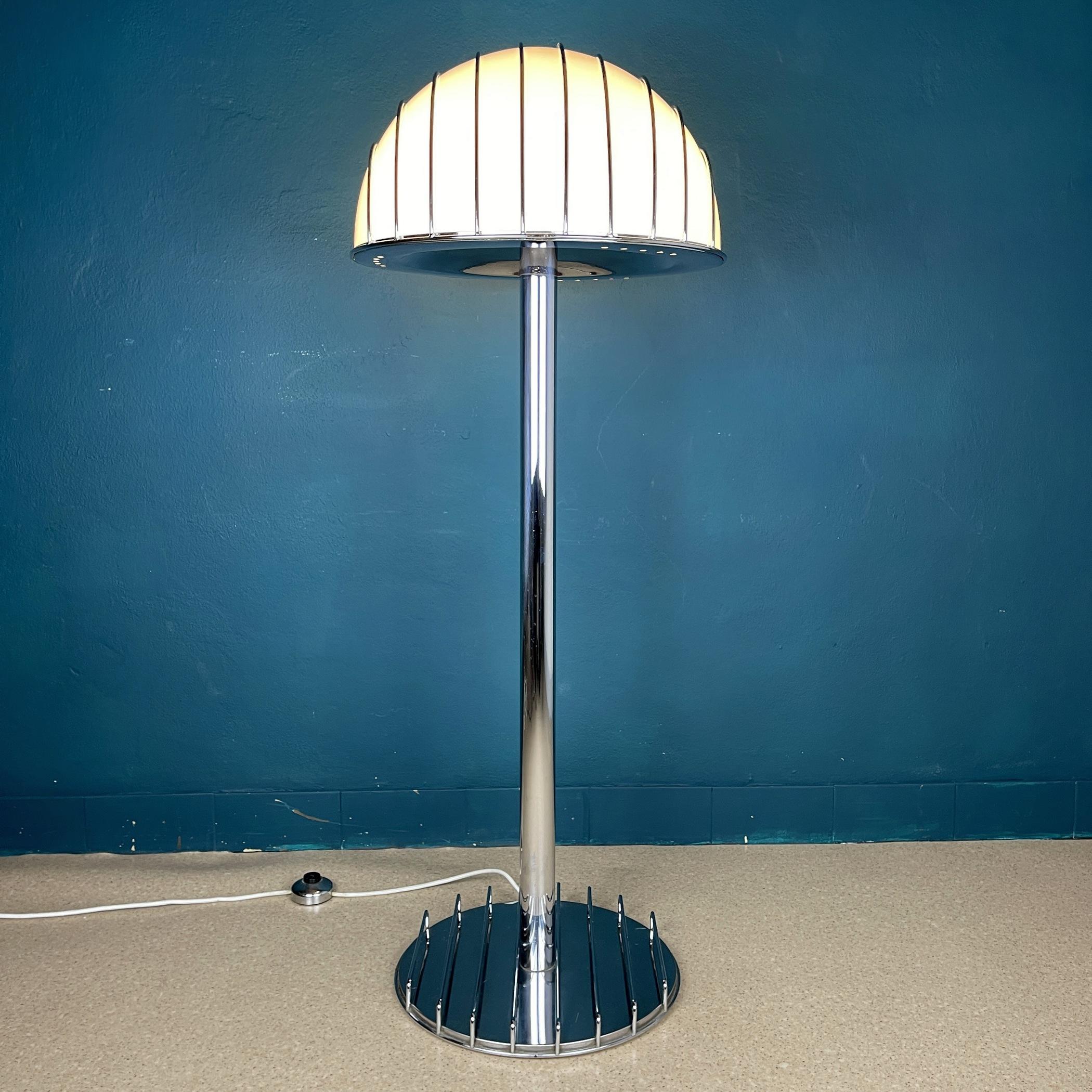 The Mid-Century Modern floor lamp by Adalberto Dal Lago for Esperia was made in Italy in the 1960s. This attractive item is crafted from chromed metal and perspex. The lampshade and base have metal rods around, which gives it a unique look,