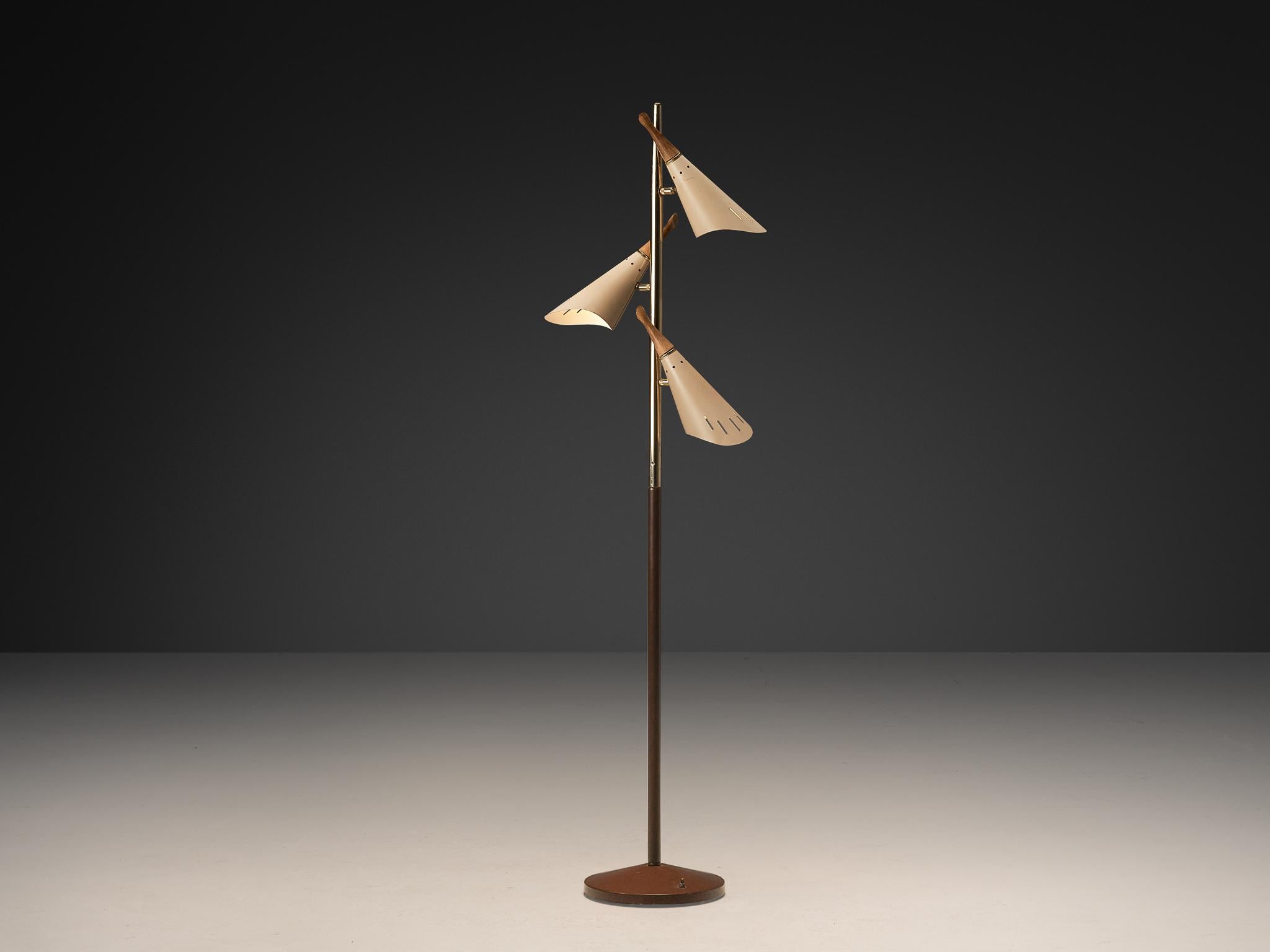 Floor lamp, coated aluminum, brass-plated iron, coated iron, wood, Europe, 1950s

This floor lamp embodies modern elegance with its trio of distinctively contoured beige shades. A slender stem rises from a sturdy round base, coated in rich brown,