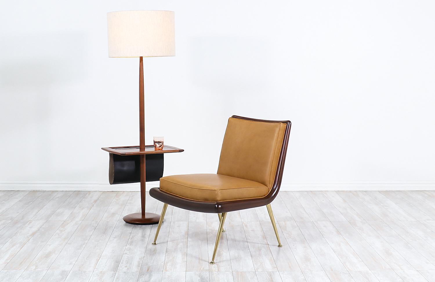 Mid-Century Modern floor lamp with side table and magazine holder by Laurel.


Dimensions:
58in H x 20in W x 15in D
Lamp shade: 12in H x 18in W
Side table height: 20.50in.