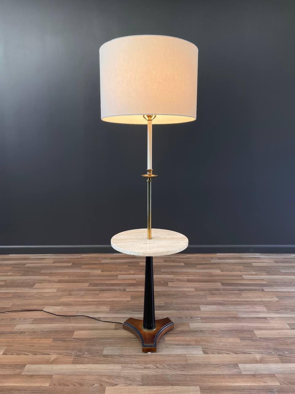 Newly Rewired, New Linen Shade, Wood in Original Vintage Condition

Dimensions: 
57.50”H x 16”W x 16” D
Shade:
12”H x 18”W x 18”D

Materials: New Linen Shade, Patinated Brass, Ebonized Wood, Italian Travertine 