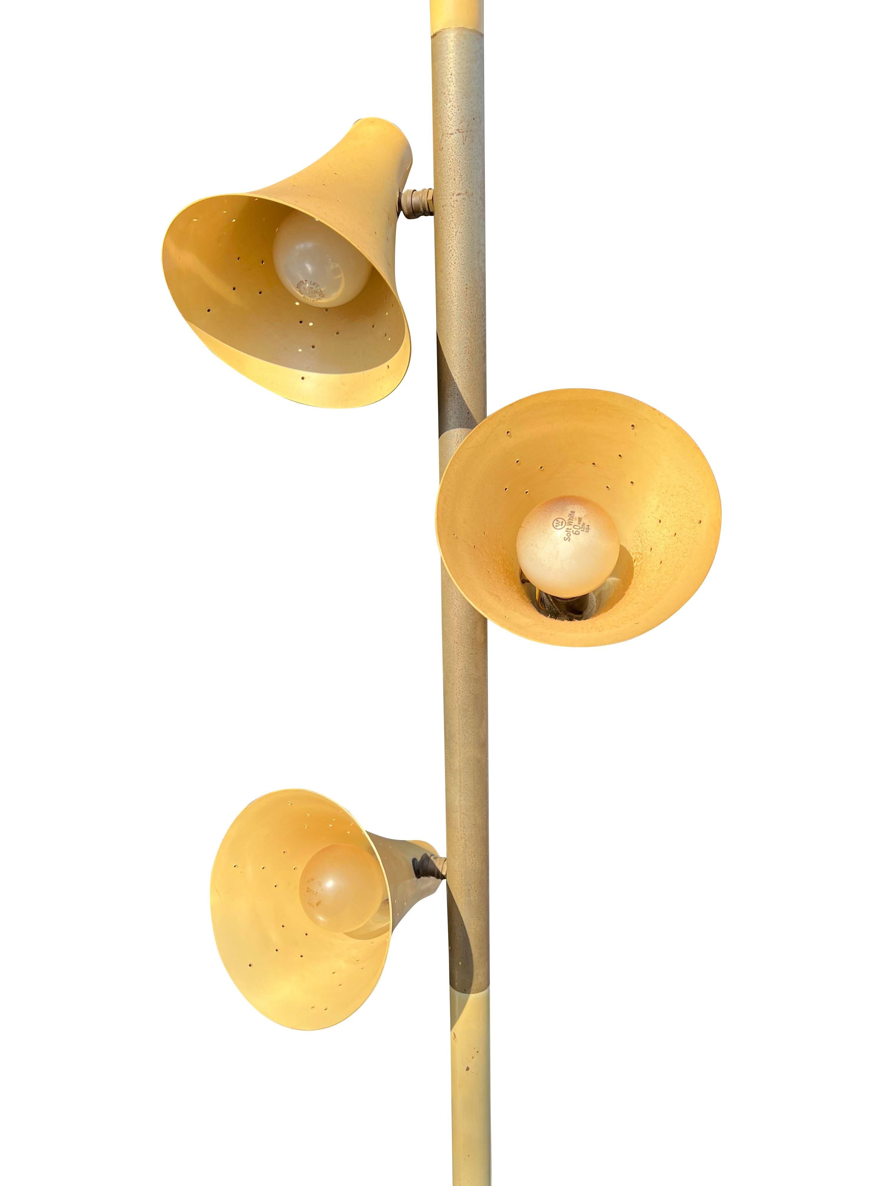 Mid-Century Modern Vintage Floor to Ceiling Pole Lamp with 3 Adjustable Heads.

Add a touch of mid-century modern elegance to your home with this stunning vintage floor-to-ceiling pole lamp. This versatile piece features three adjustable heads,