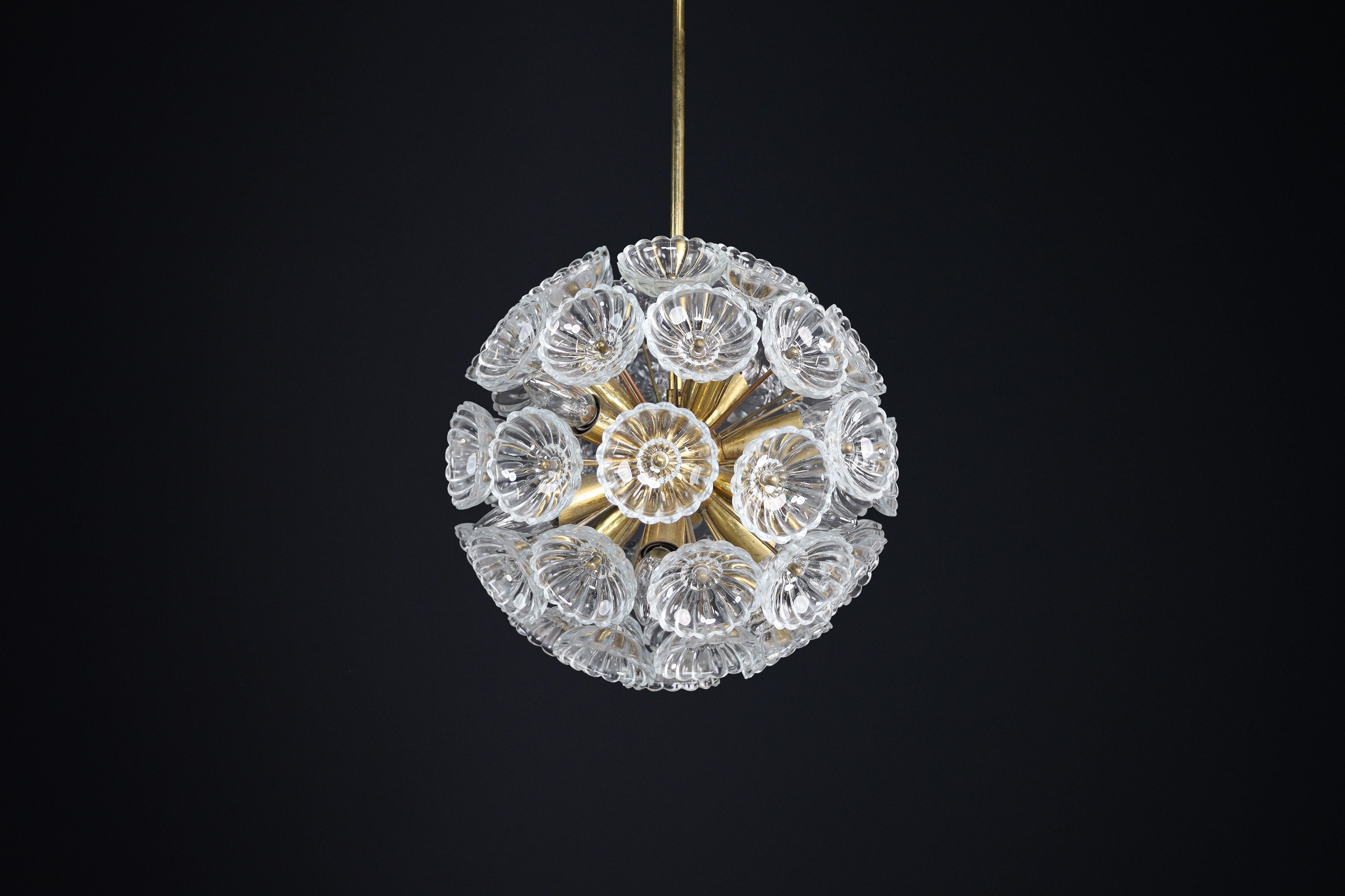 Mid-Century Modern Floral Glass and Brass Chandelier, Germany, 1960s
Six Available  Price Per Item

This beautiful mid-century modern chandelier from 1960s Germany is a sculptural statement piece that reflects the era's signature sophistication and