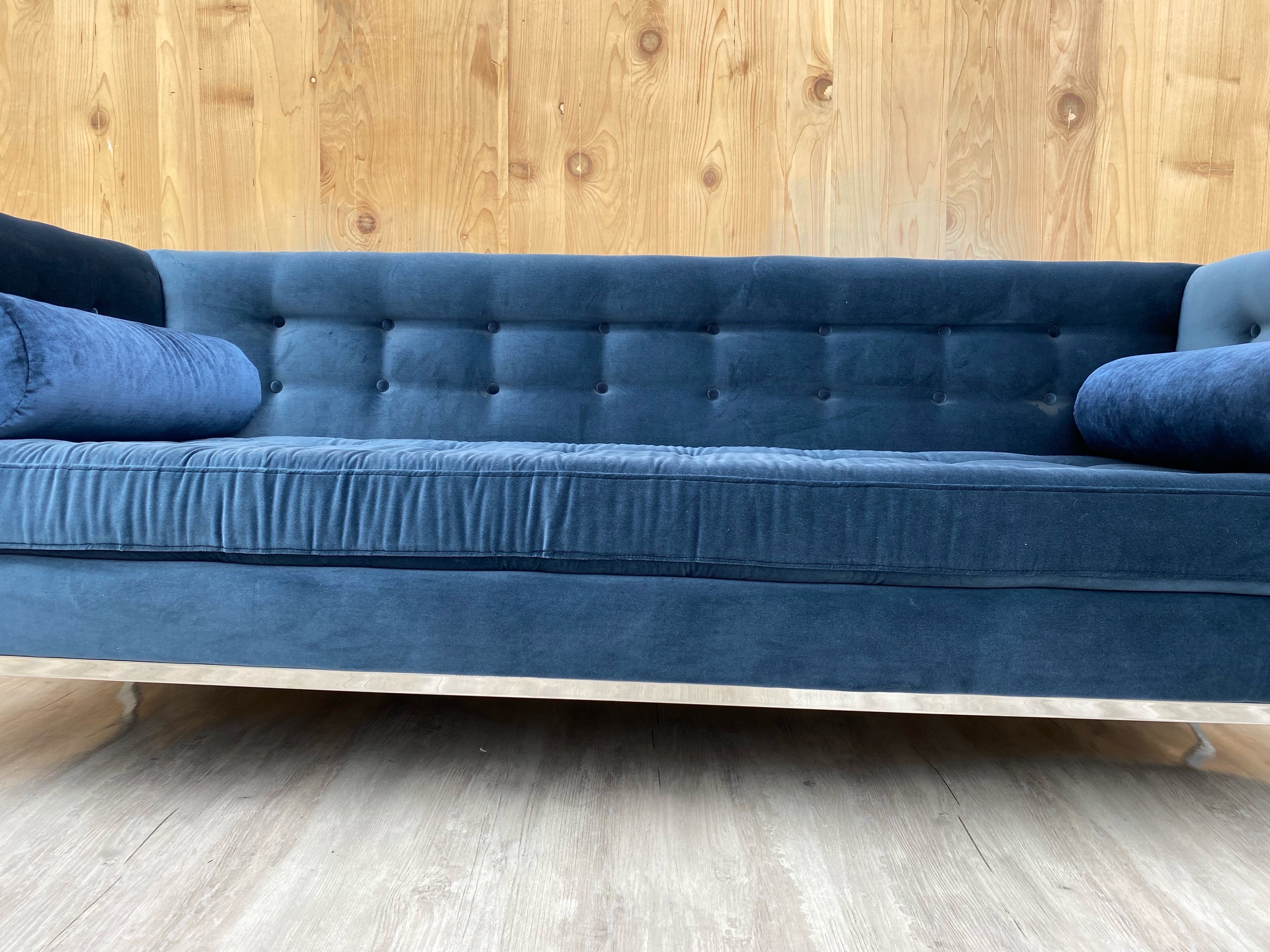 Mid Century Modern Florence Knoll Chrome Base Sofa Newly Upholstered in a Blue Velvet 

Beautiful MCM Florence Knoll Sofa made in the Style of Jonathan Adler's Lampert Sofa. The sofa has been newly reupholstered in a high end plush blue Egyptian