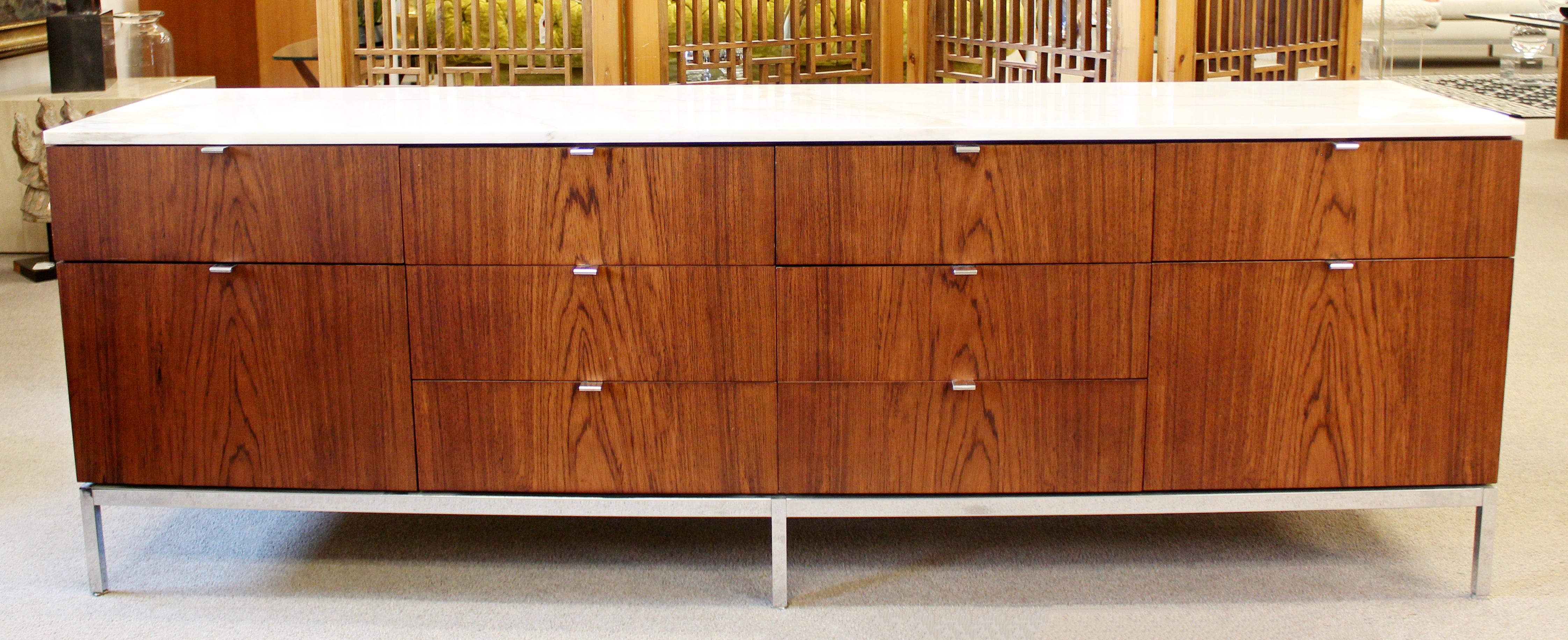 For your consideration is a ravishing, rosewood credenza, with a white marble top, and ten drawers with chrome pulls, by Florence Knoll for Knoll International, circa 1960s. In very good vintage condition. The dimensions are 74.5