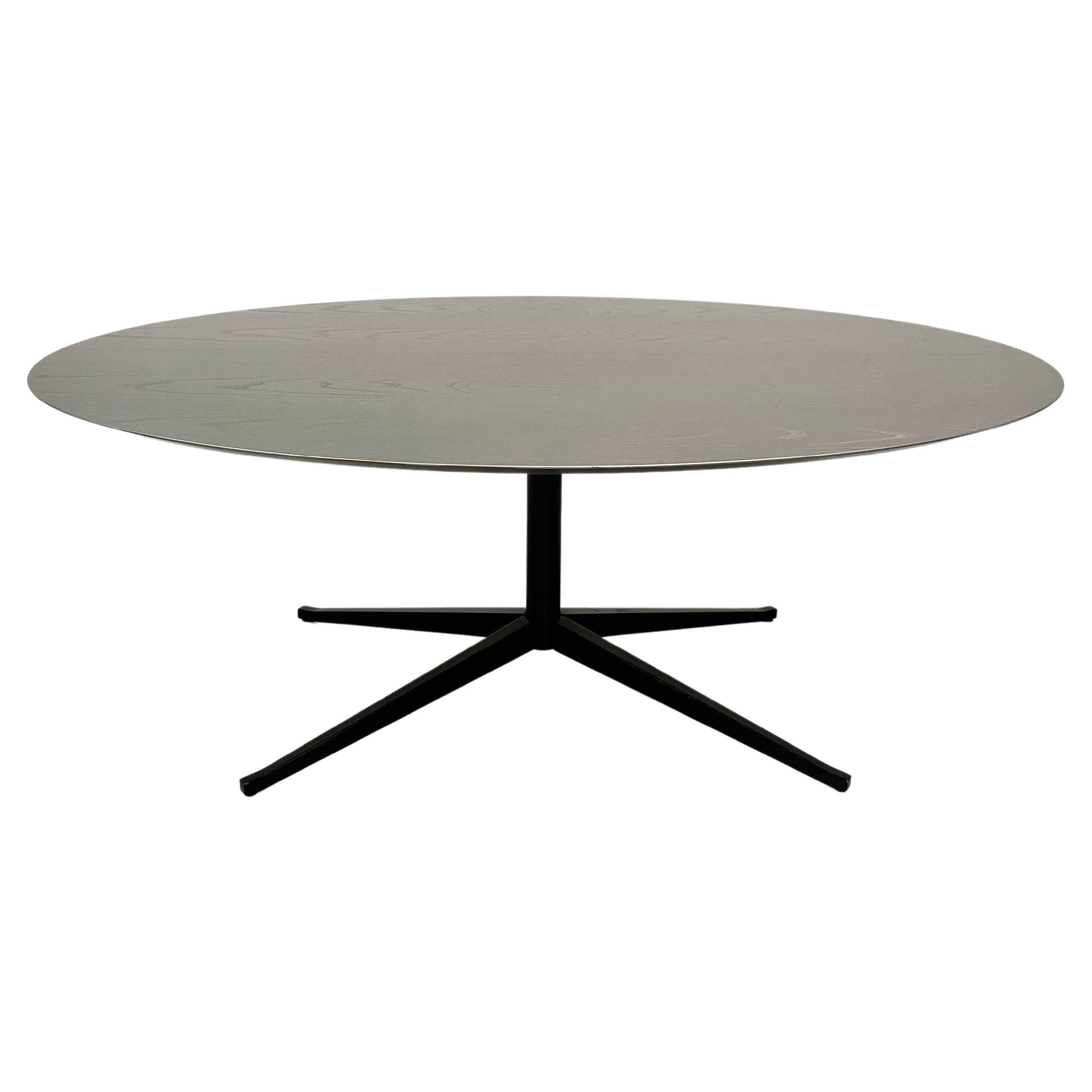 This particular Florence Knoll oval table desk is designed by Florence Knoll for Knoll in 1961. This rare edition with a silver lacquered top and solid black base in very good condition. 

Florence Knoll described her designs as the fill-in pieces