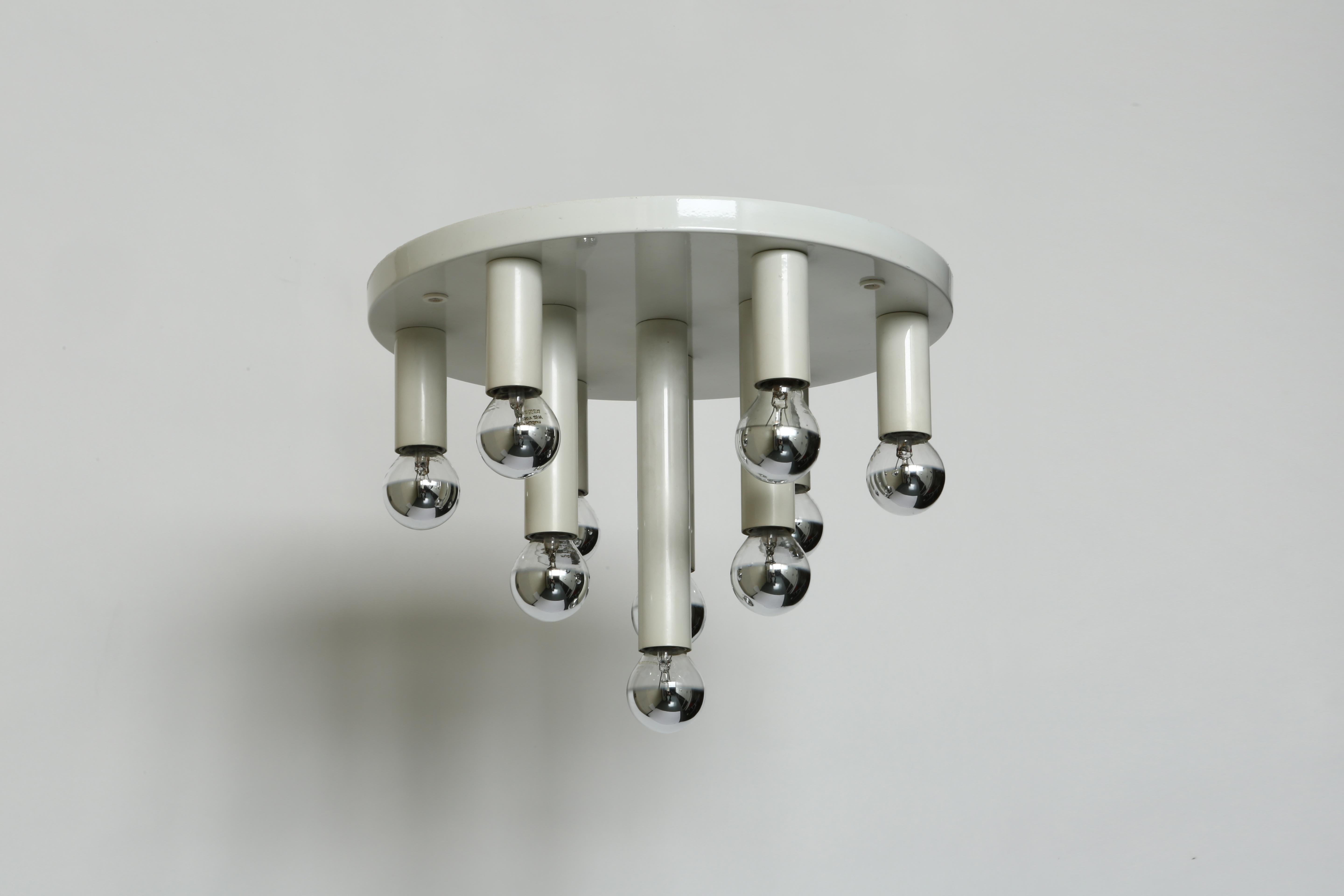 Mid-Century Modern flush mount.
Germany, 1970s.
Enameled metal.
10 candelabra sockets.
Also available in black.