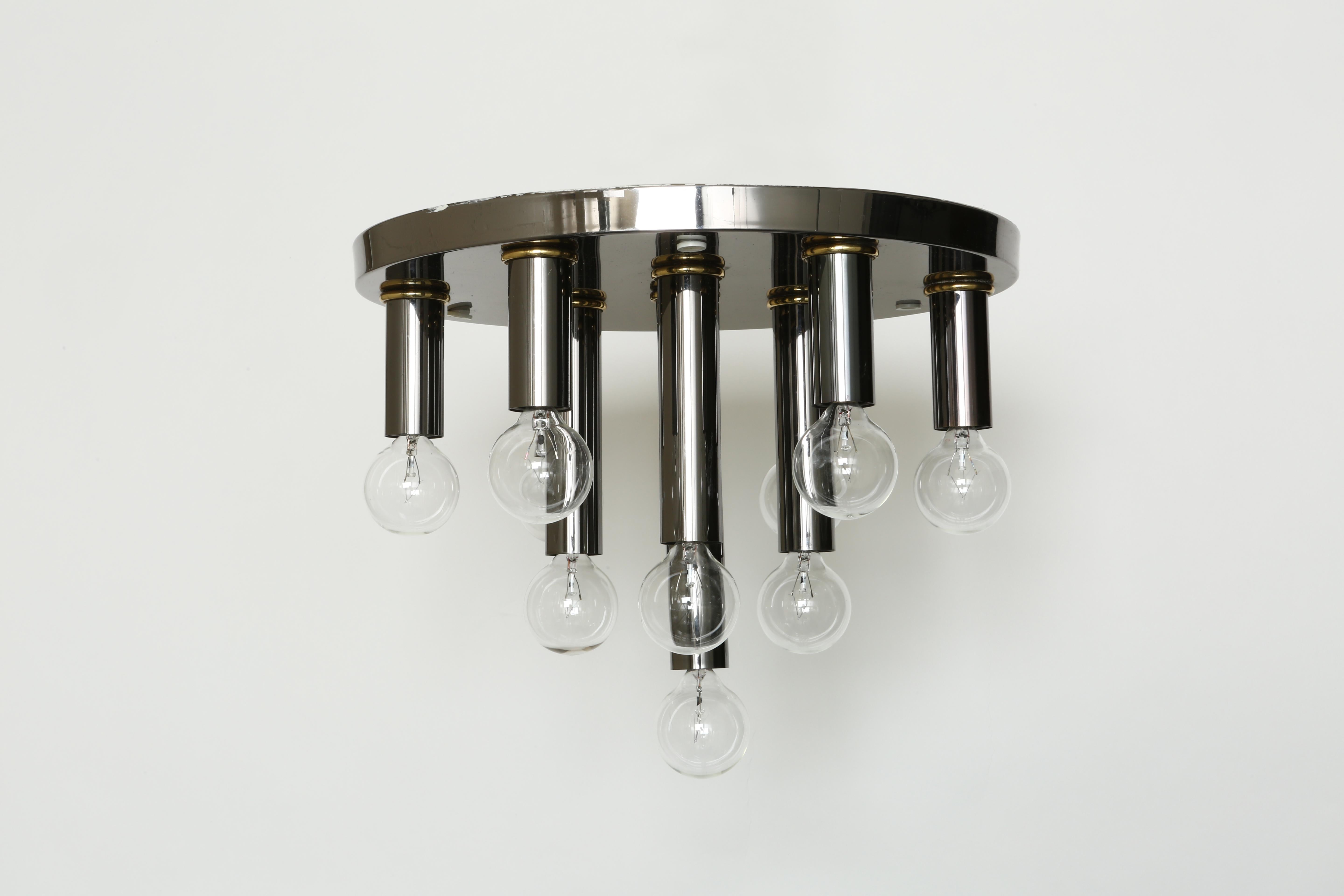 Mid-Century Modern flush mount.
Germany, 1970s.
Enameled metal.
10 candelabra sockets.
Also available in white.