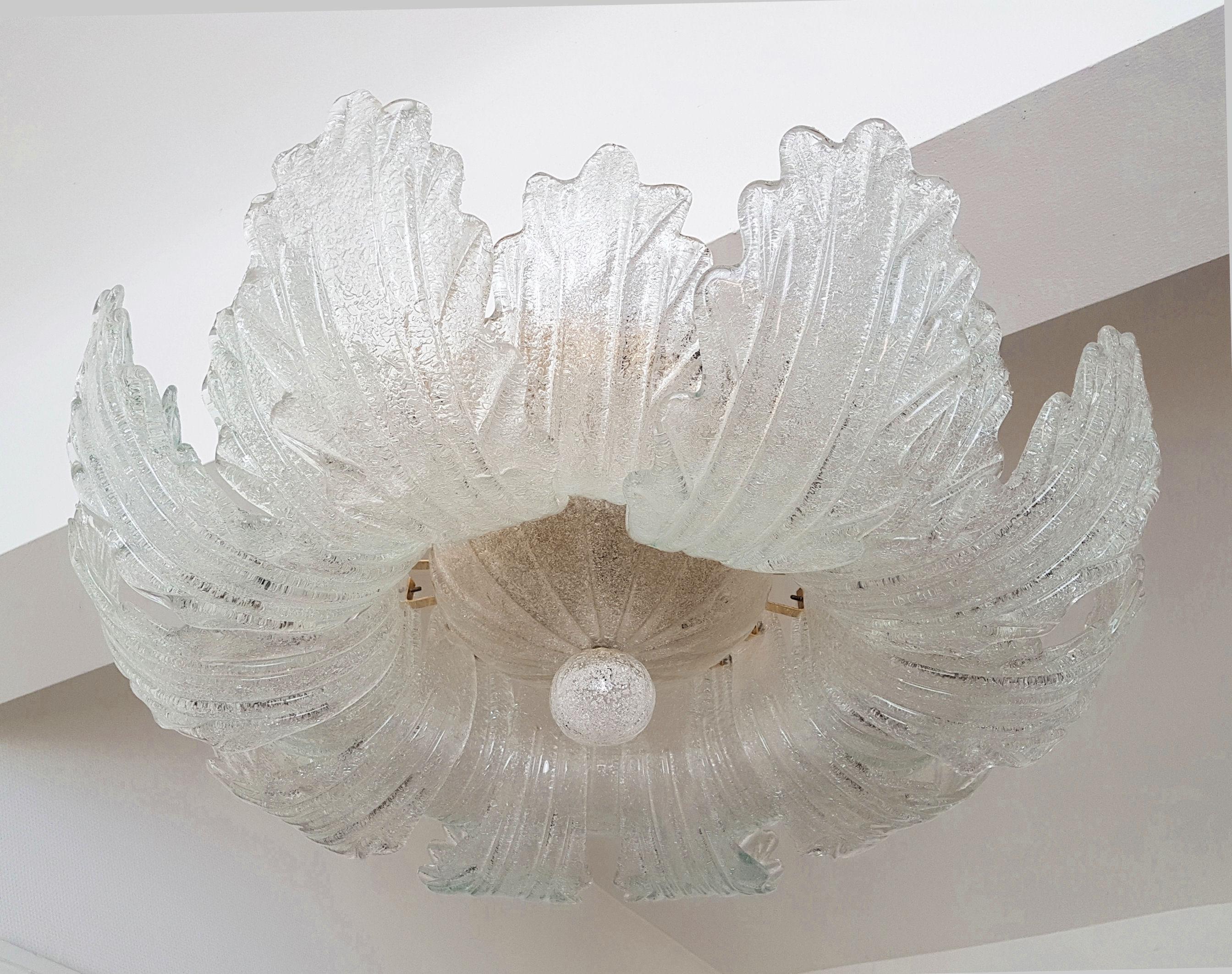 Mid-Century Modern clear, translucent Murano glass leaves flush mount chandelier, by Barovier e Toso, Italy, circa 1960s.
The frame is plated brass.
5 lights, rewired with UL materials, for the US.