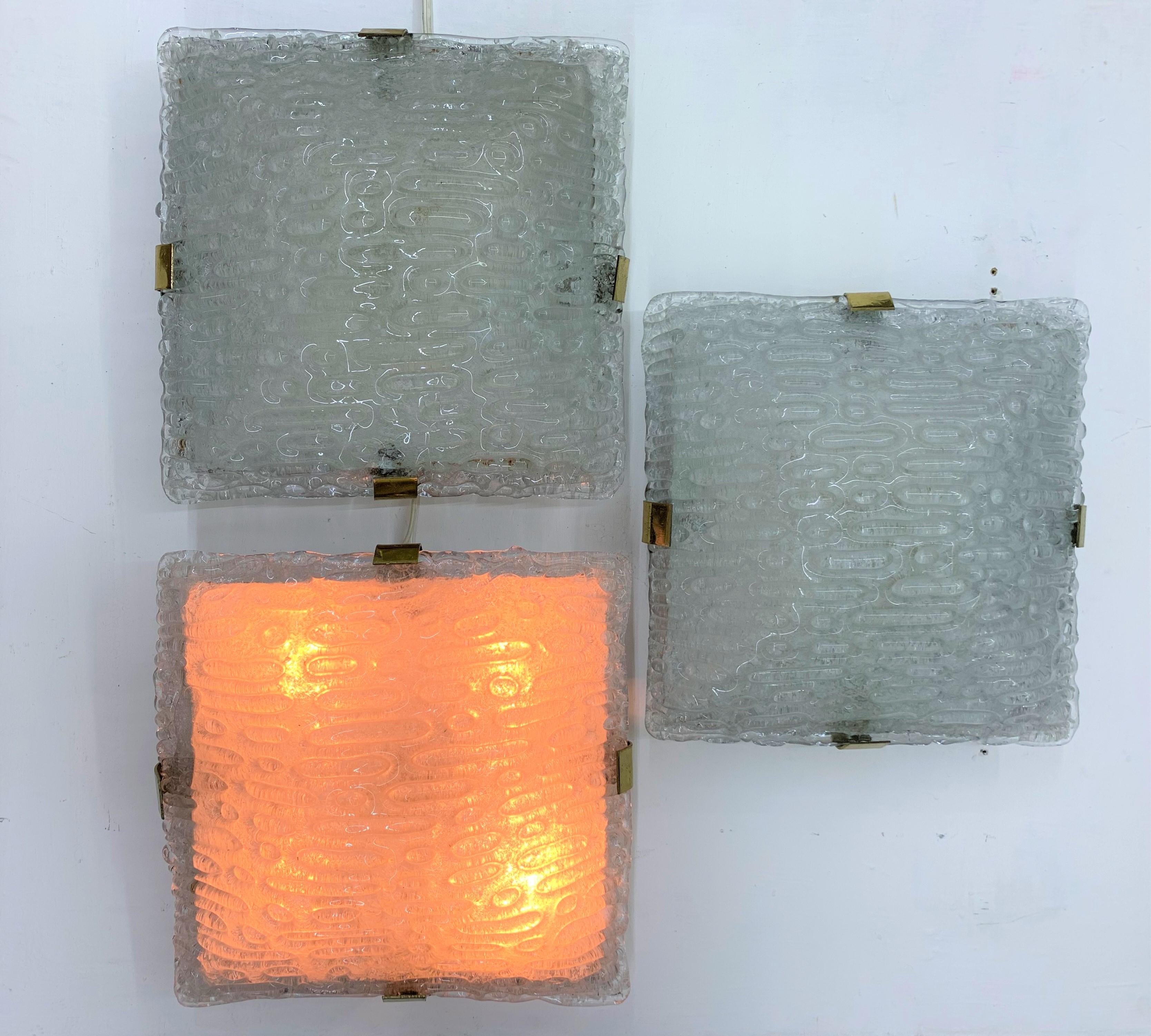 Space Age sconces flush mounts made in clear Murano glass, brass and grey lacquered metal.
Italy, circa 1970
3 available.