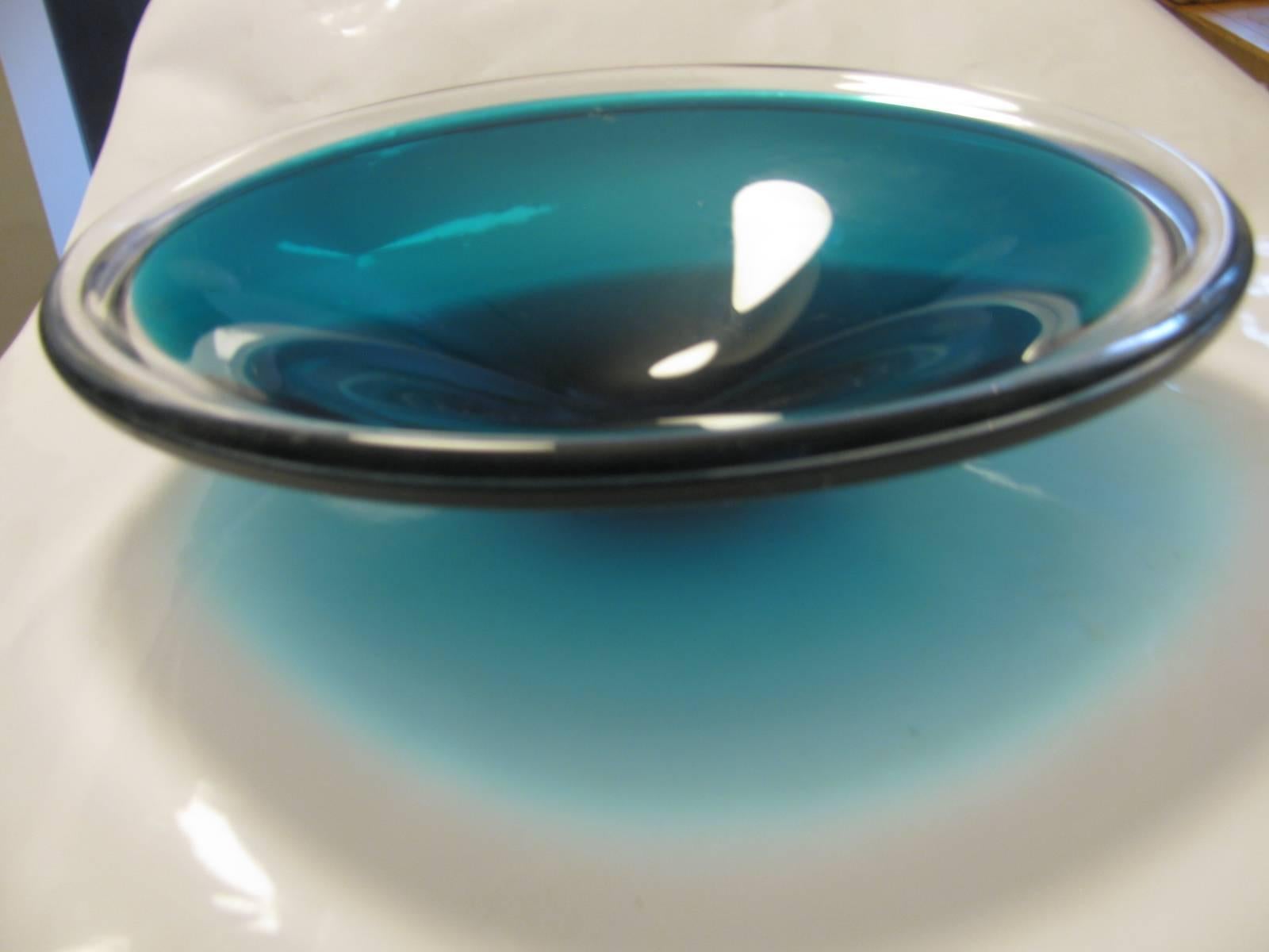 Round bowl , deep dish with cased glass, clear to sea blue. In excellent vintage condition with some wear to the underside of the base, as expected. Great Color, very serene.