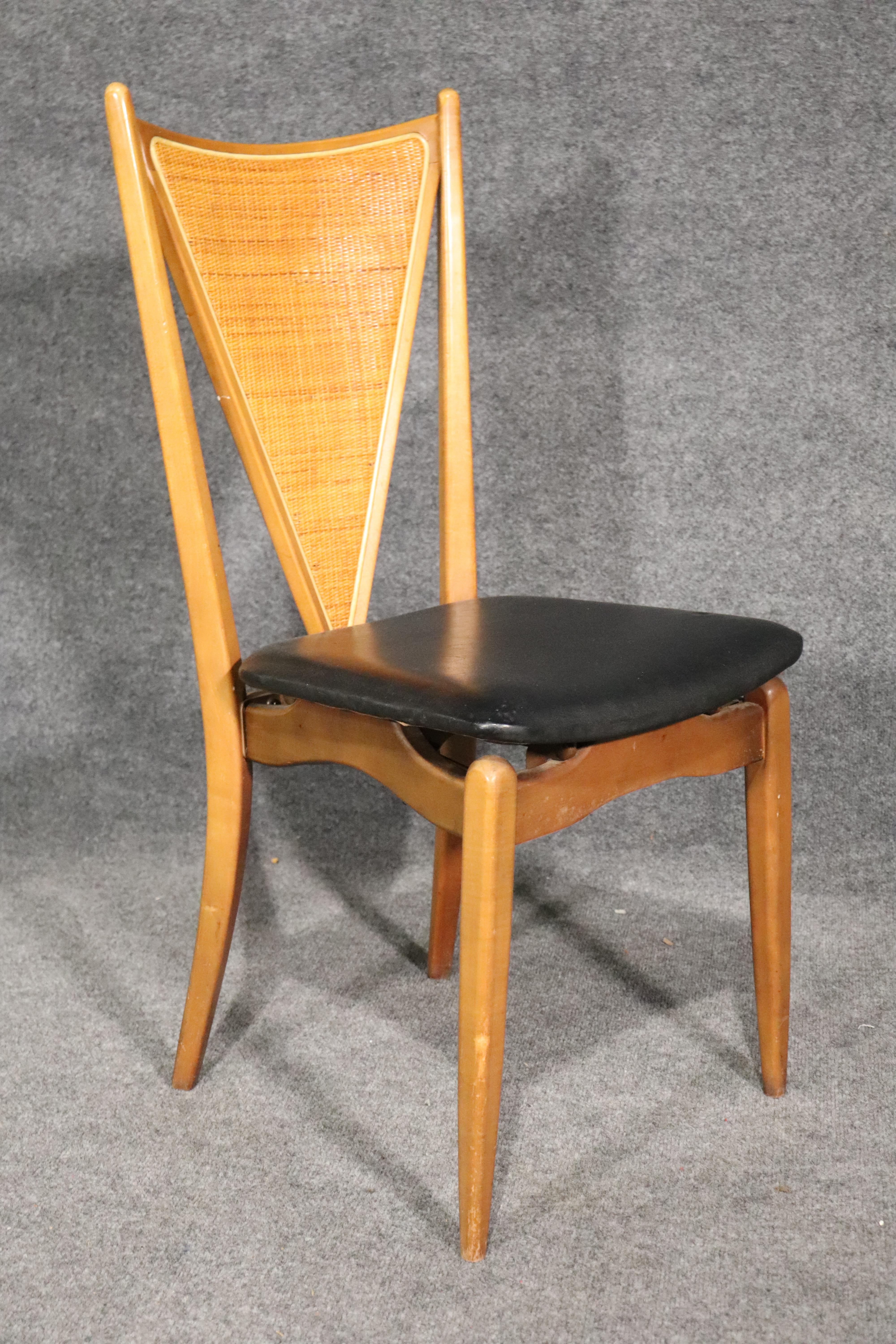 Set of four mid-century dining chairs that fold up for storage. Great V shaped back with woven caning.
Please confirm location.