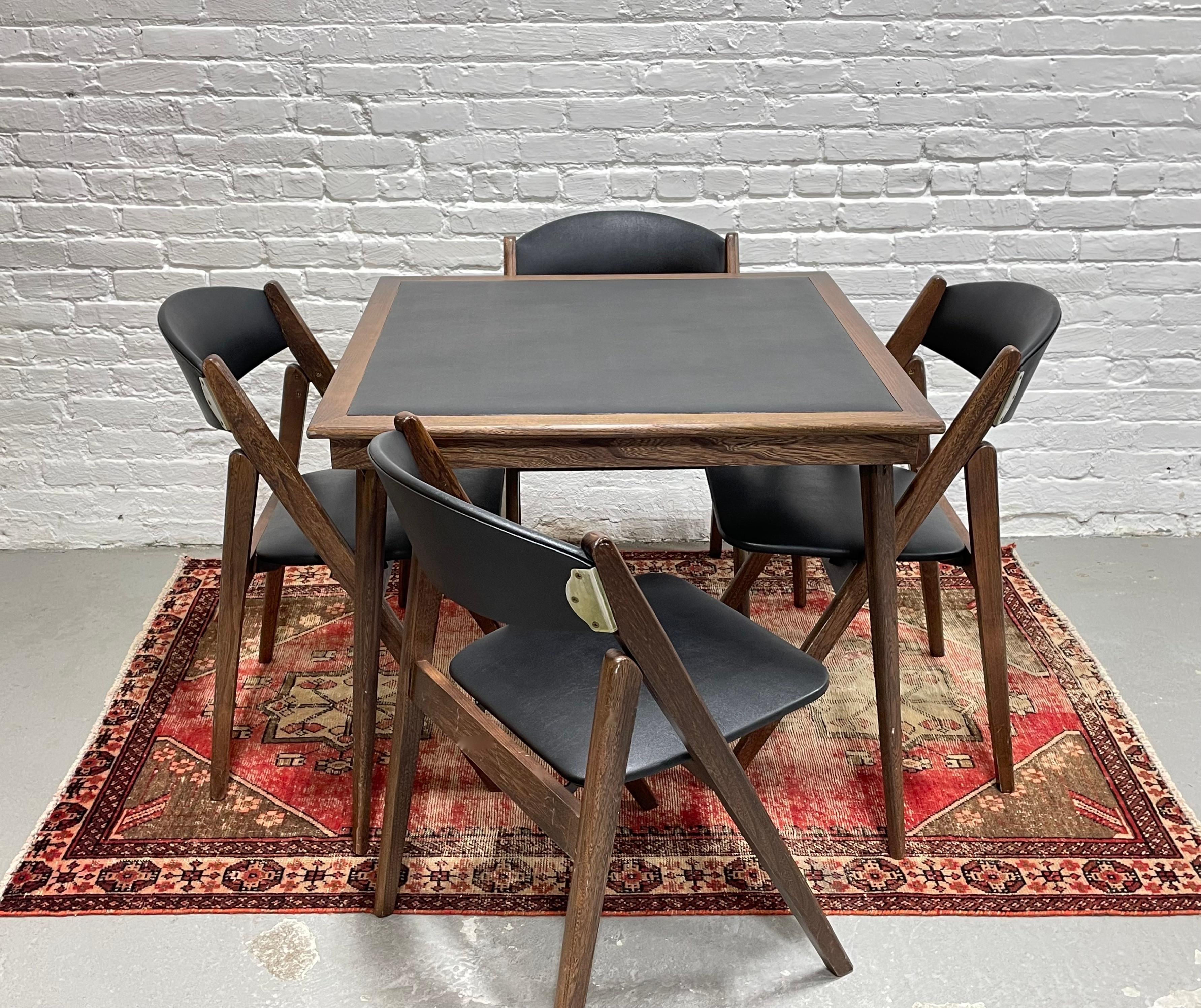 Mid century Modern foldable / collapsable dining set / game table set by Stakmore.  Both the table and chairs fold flat for easy storage when not in use. This is a perfect set for smaller apartments when you don't always need a dining table set up