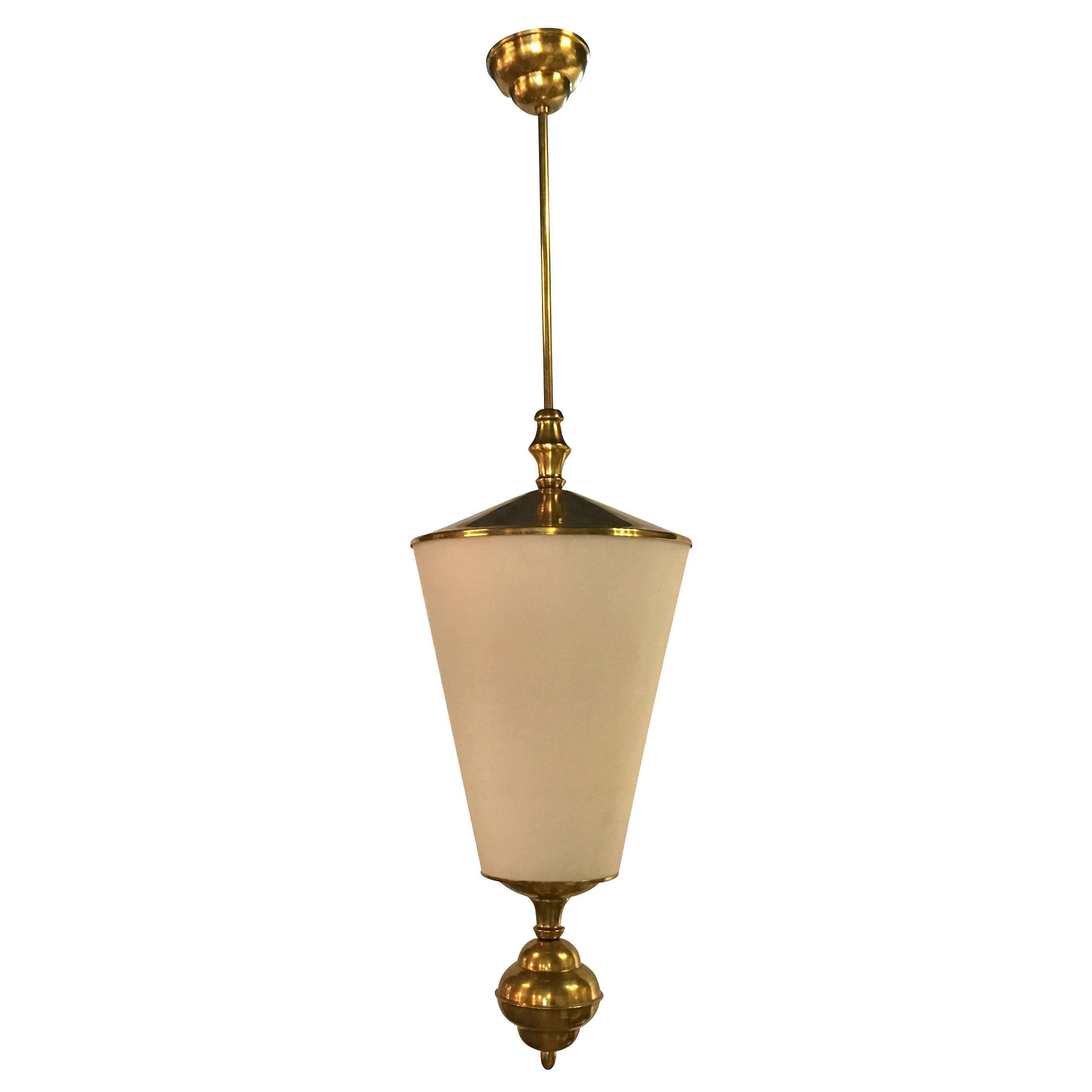 A rare pendant made of frosted glass and brass. Designed by Pietro Chiesa for Stilnovo, produced by Fontana Arte. Wear consistent with age and use. Circa 1950, Italy.

Lamp Height: 21.7″

Pietro Chiesa was an Italian designer born in 1892 Milan,