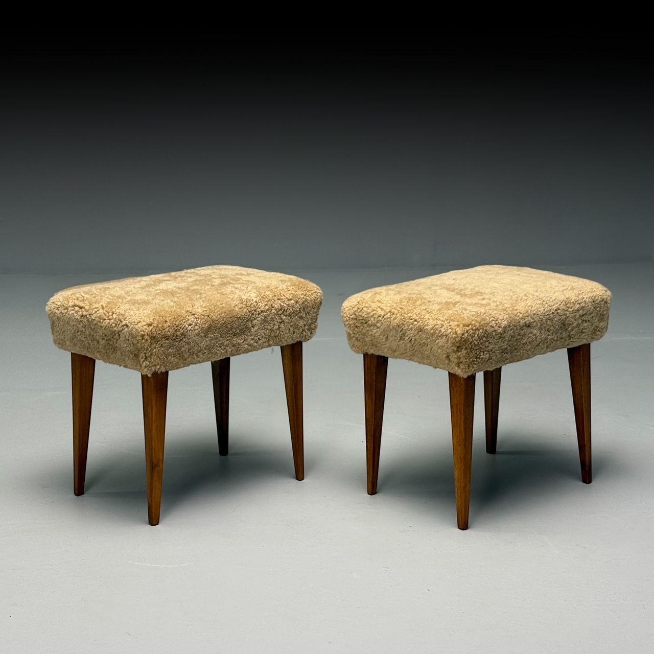 Mid-Century Modern, Footstools or Ottomans, Honey Shearling, Stained Wood, Italy, 1950s

A pair of straight leg stools or ottomans, designed and produced in Italy circa 1950s. Featuring newly upholstered genuine honey sheepskin tops sitting on