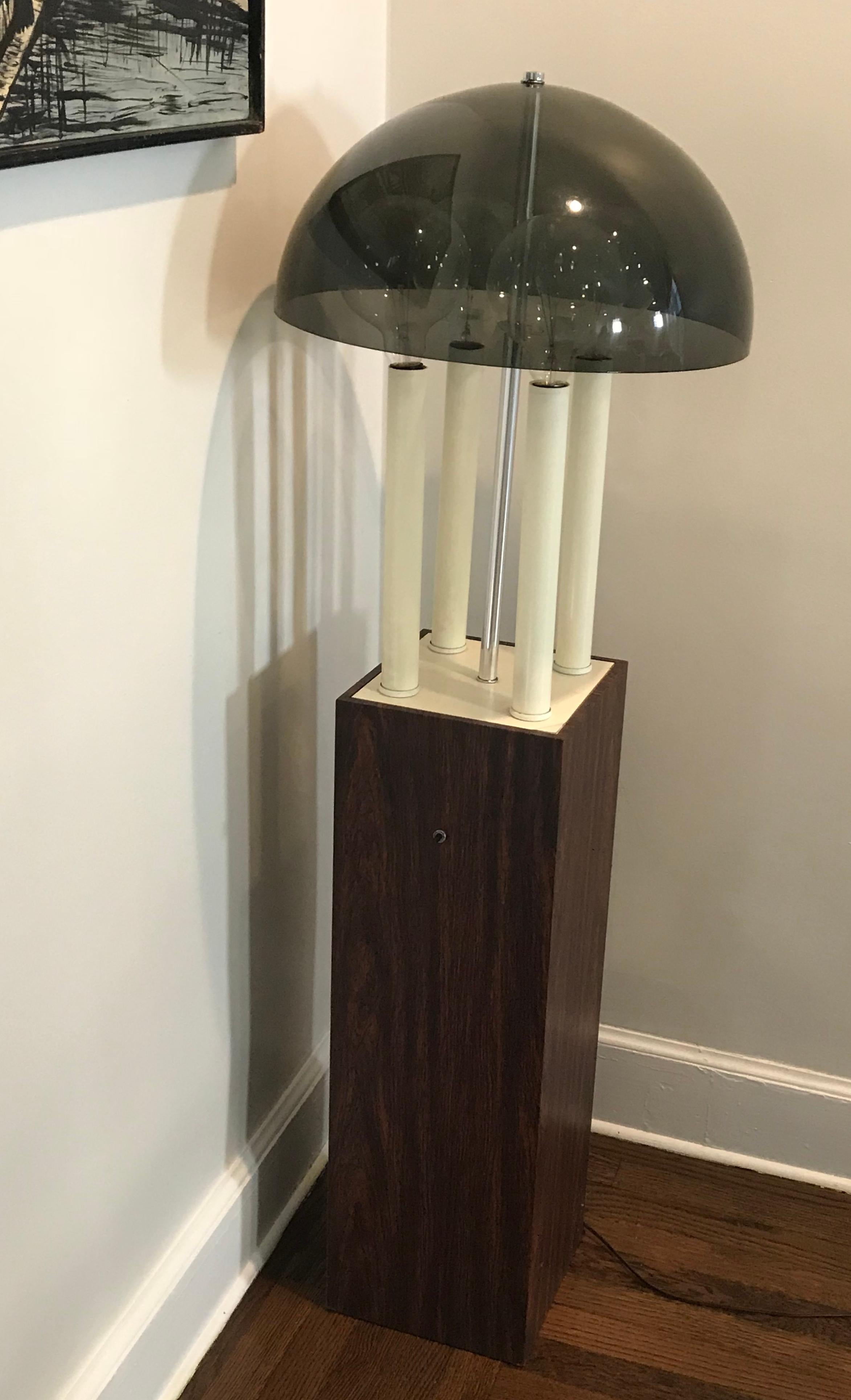Funky midcentury 1970s floor lamp with four bulbs and smoked gray plastic dome shade, faux rosewood square base. Rewiring recommended.