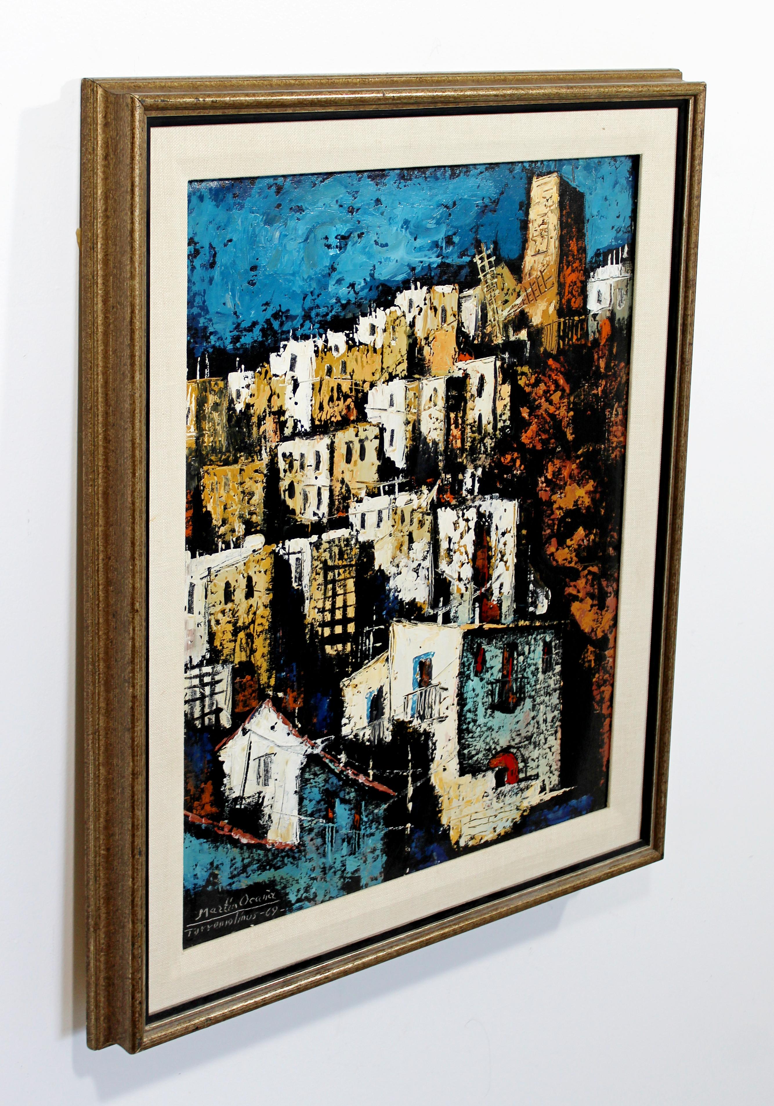 For your consideration is a fantastic, framed, oil on canvas painting, depicting a city scene, signed by Martin Ocanez, dated 1969. In excellent condition. The dimensions are 22.5