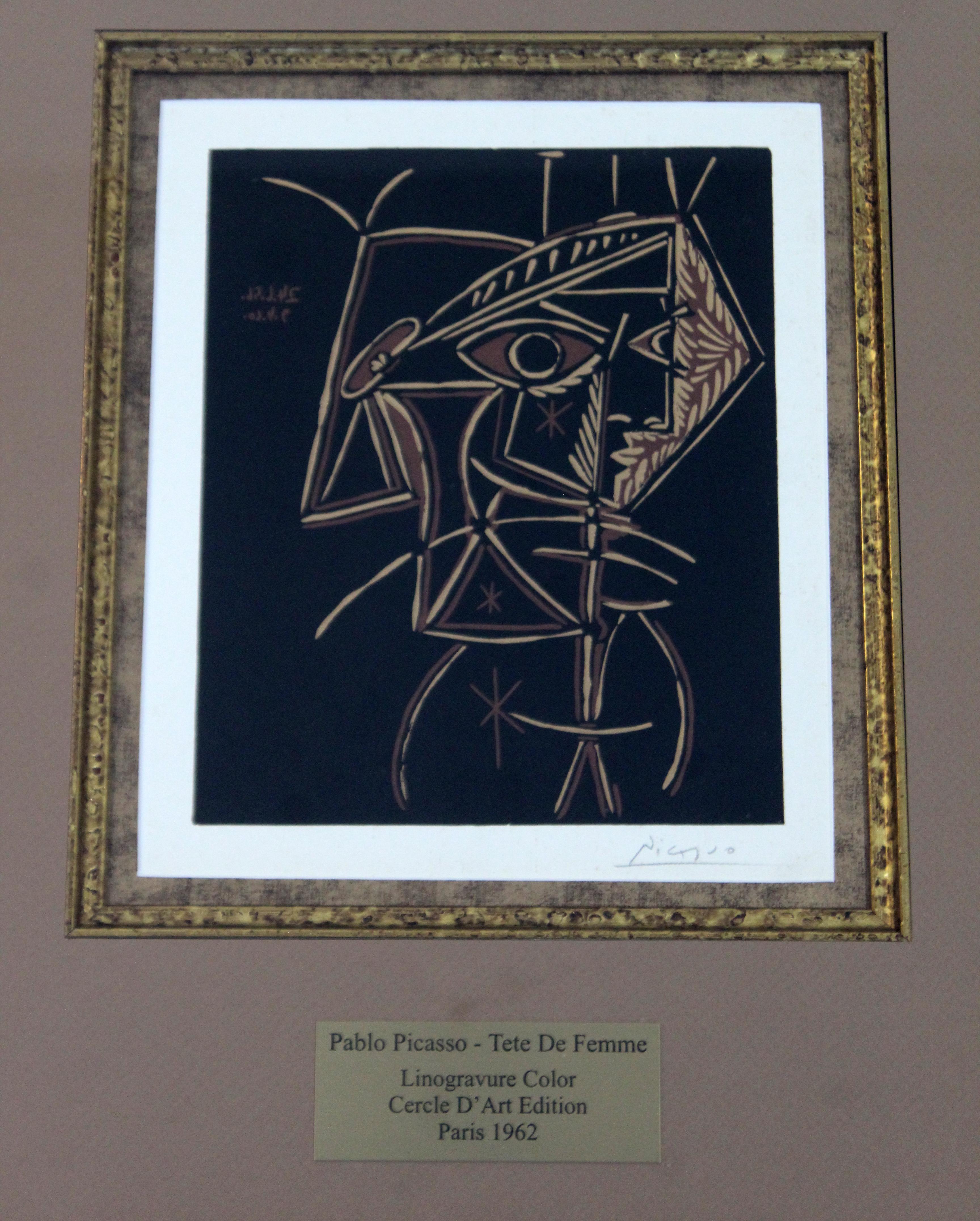 For your consideration is a fantastic, signed lithograph on dark paper, by Pablo Picasso, in gold frame with nameplate. This image is extremely hard to find. Picasso is best known for printmaking, paintings, ceramics and as a poet who spent most of