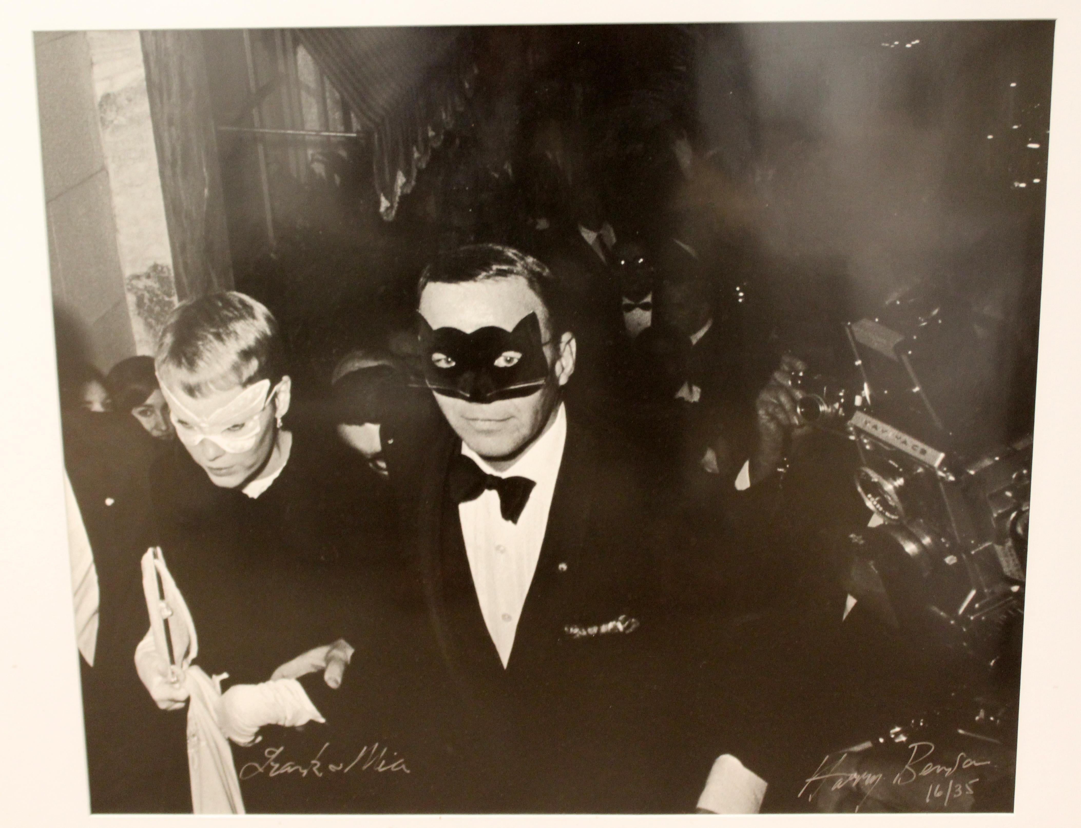 For your consideration is a framed print of a Harry Benson photograph that shows Frank Sinatra and Mia Farrow at the Capote Ball, circa 1966, numbered 16/35 and signed. In excellent condition. The dimensions of the frame are 40
